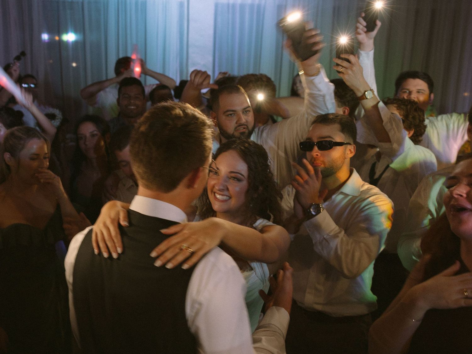 Wedding couple photographed in natural light
Bride and groom embracing during wedding day
Candid moment from a Florida wedding