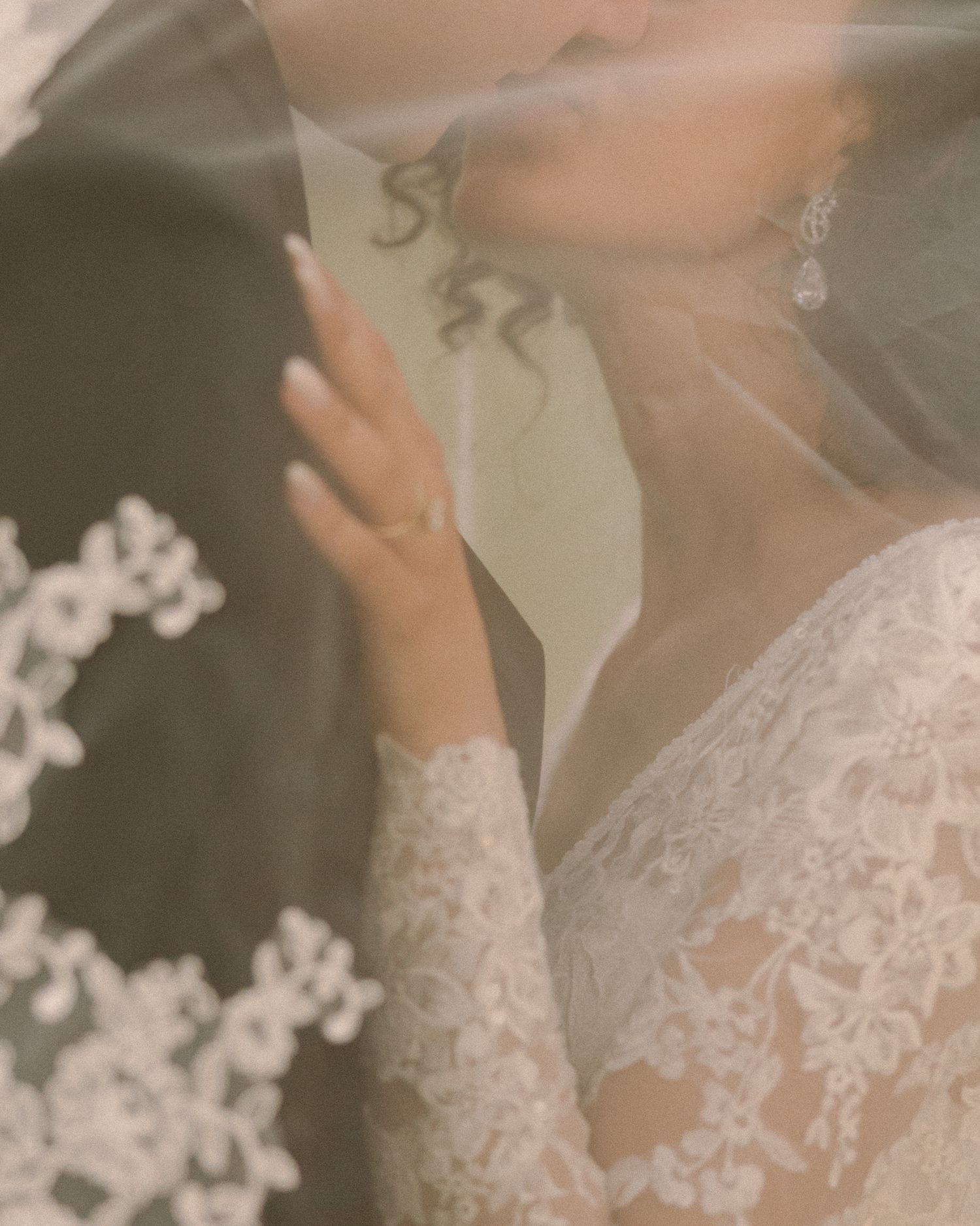Newlyweds share their first kiss during the ceremony exit, surrounded by cheering guests.