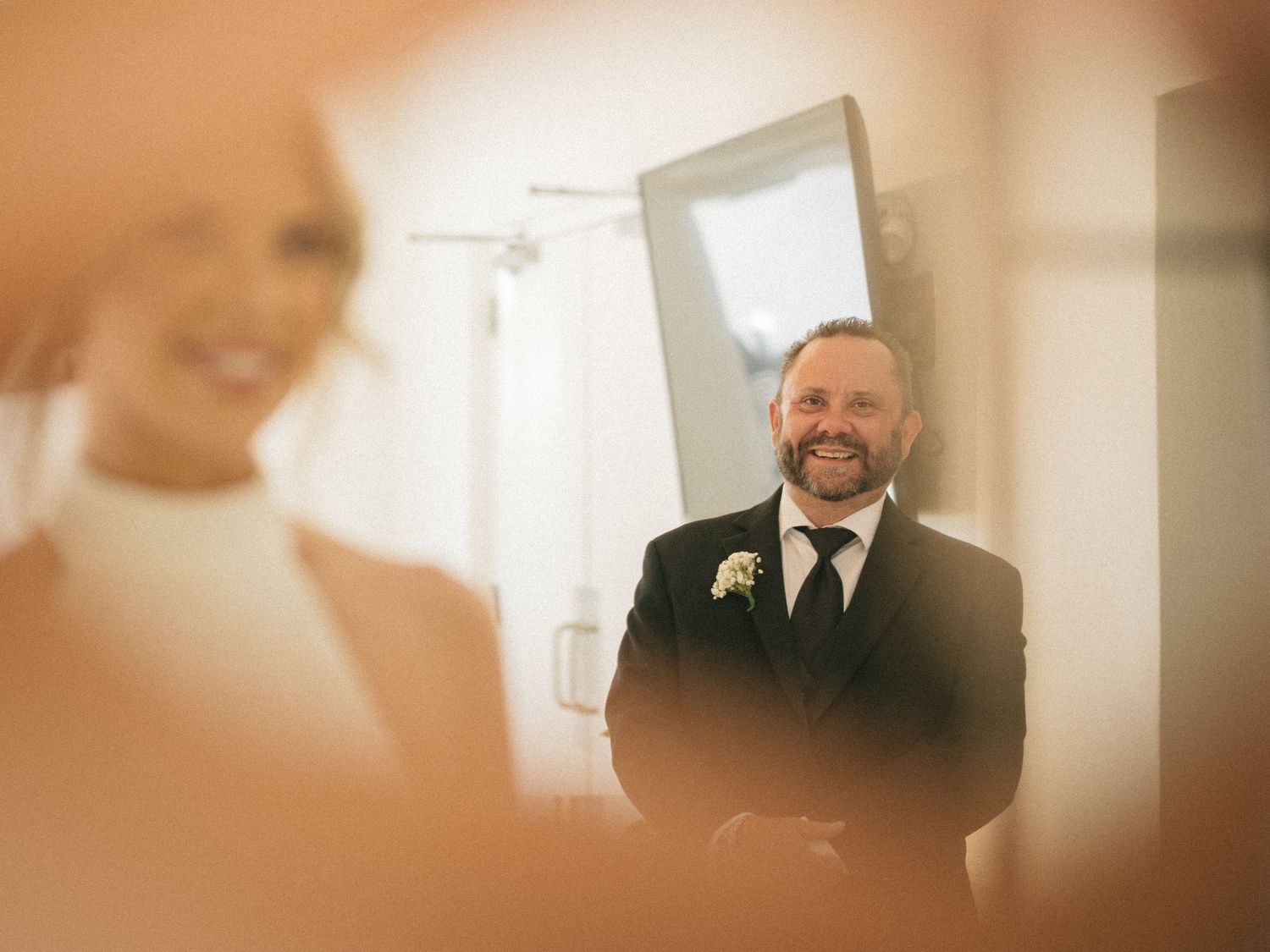 Wedding couple photographed in natural light
Bride and groom embracing during wedding day
Candid moment from a Florida wedding