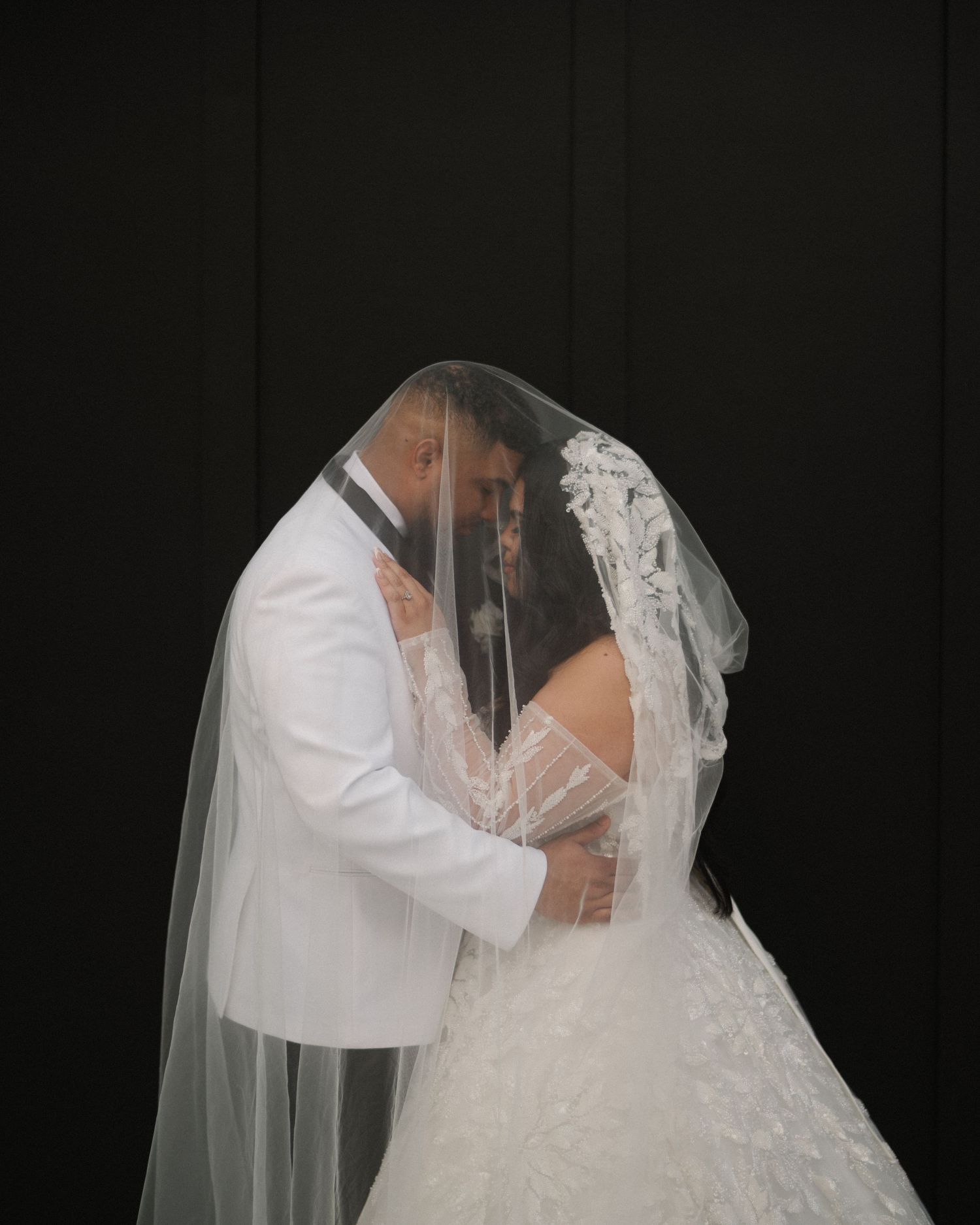 Wedding couple photographed in natural light
Bride and groom embracing during wedding day
Candid moment from a Florida wedding