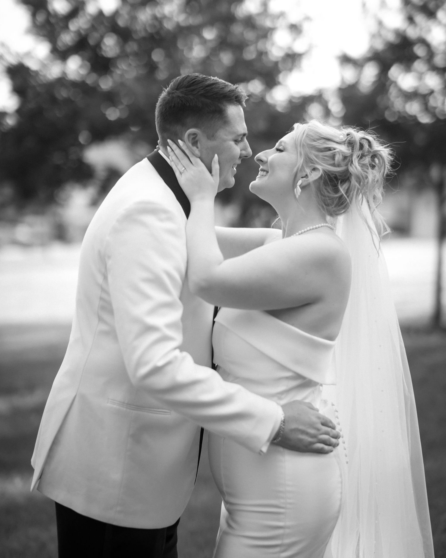 Wedding couple photographed in natural light
Bride and groom embracing during wedding day
Candid moment from a Florida wedding