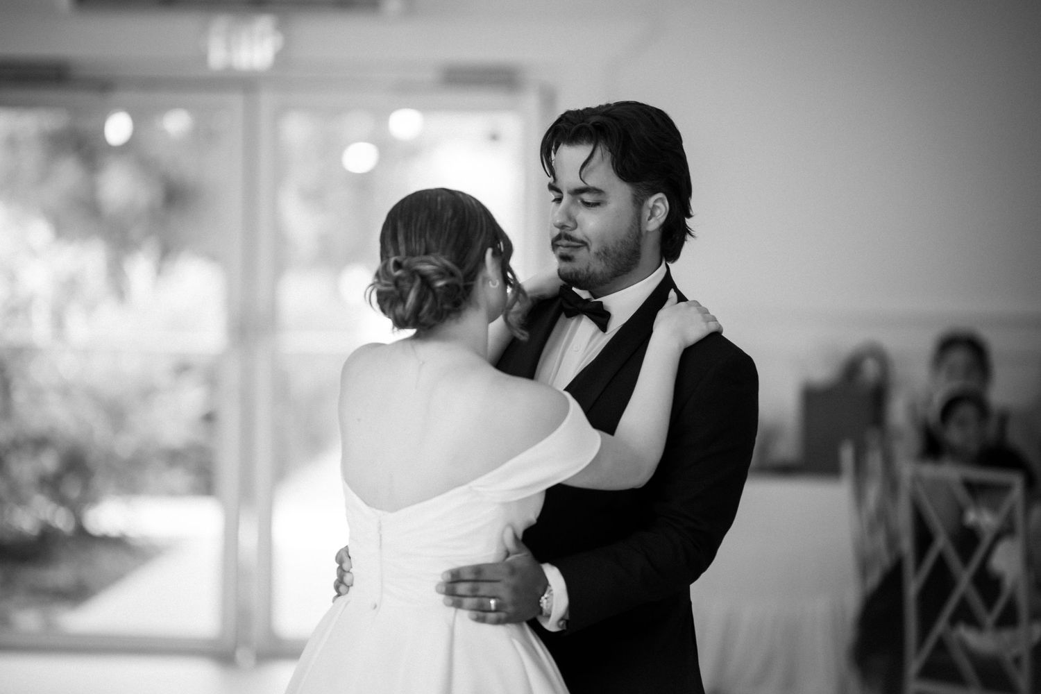 Wedding couple photographed in natural light
Bride and groom embracing during wedding day
Candid moment from a Florida wedding