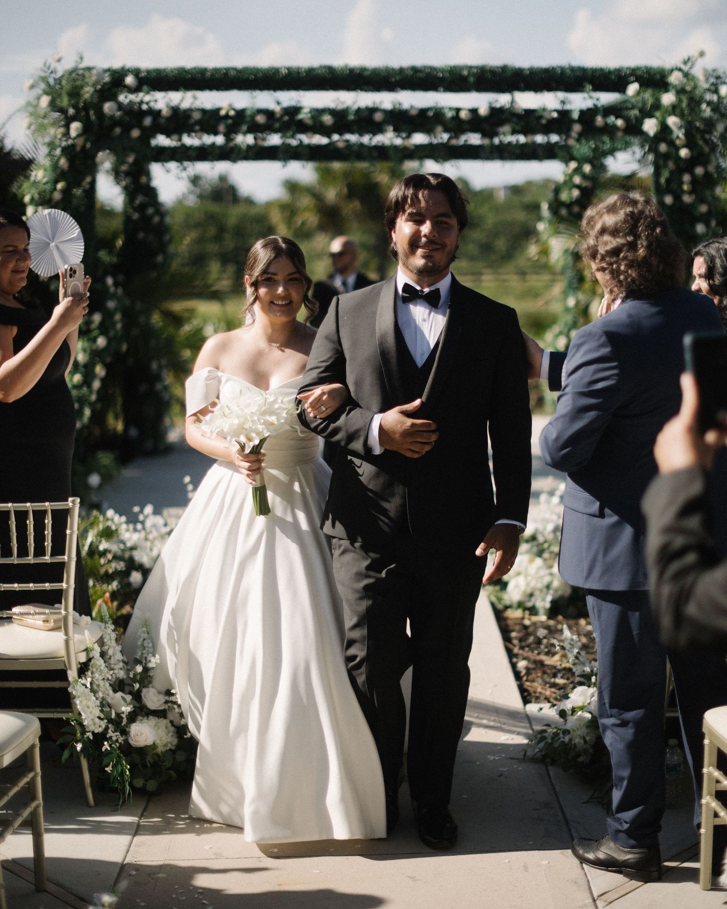 Wedding couple photographed in natural light
Bride and groom embracing during wedding day
Candid moment from a Florida wedding