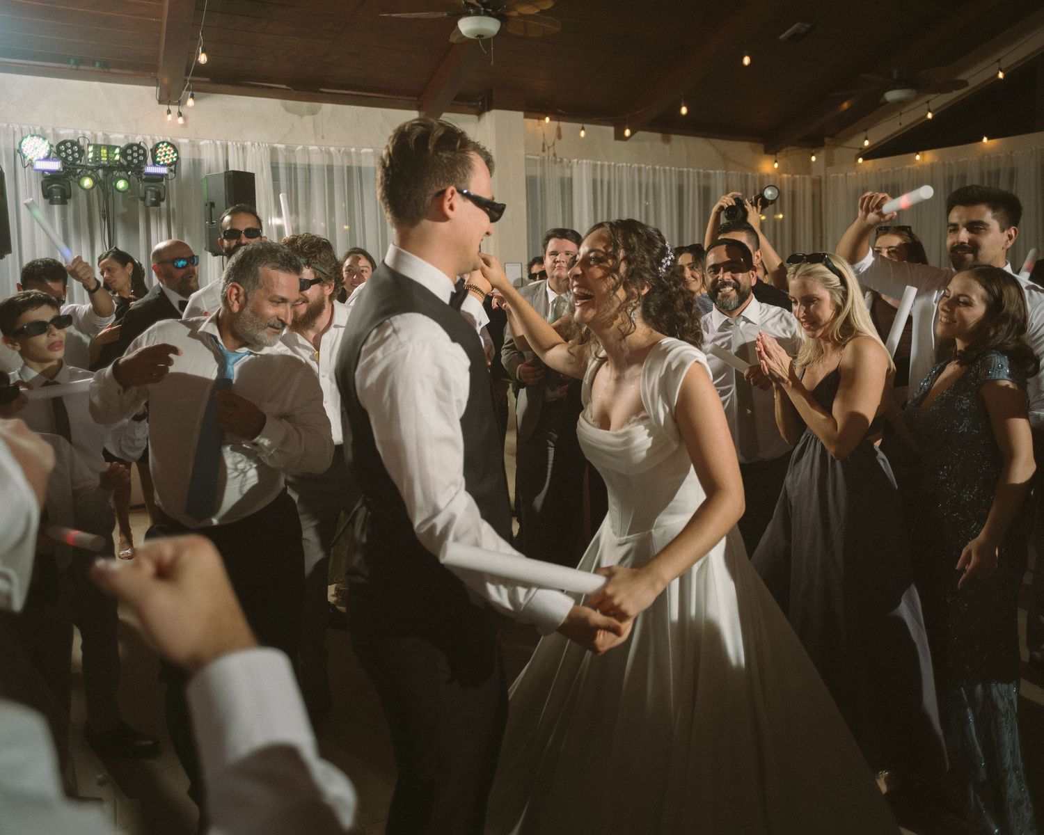 Wedding couple photographed in natural light
Bride and groom embracing during wedding day
Candid moment from a Florida wedding