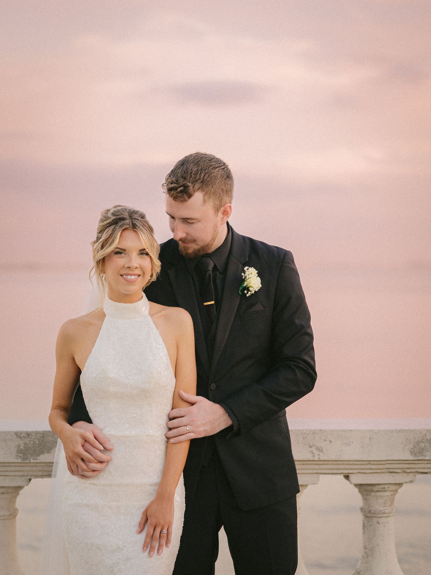 Wedding couple photographed in natural light
Bride and groom embracing during wedding day
Candid moment from a Florida wedding