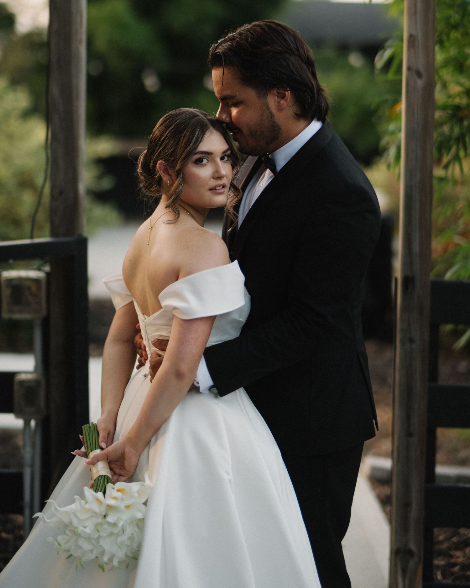 Wedding couple photographed in natural light
Bride and groom embracing during wedding day
Candid moment from a Florida wedding