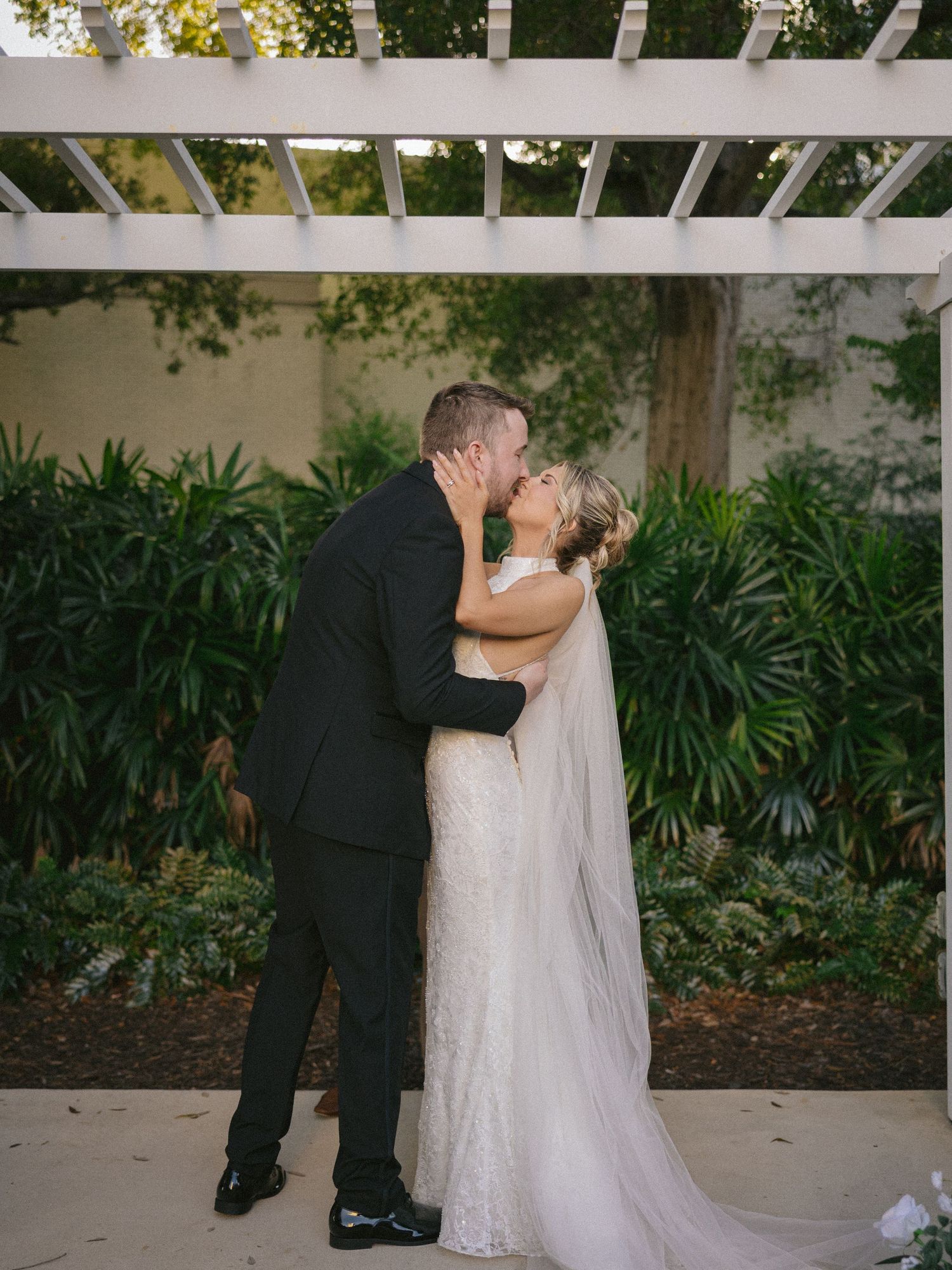 Wedding couple photographed in natural light
Bride and groom embracing during wedding day
Candid moment from a Florida wedding