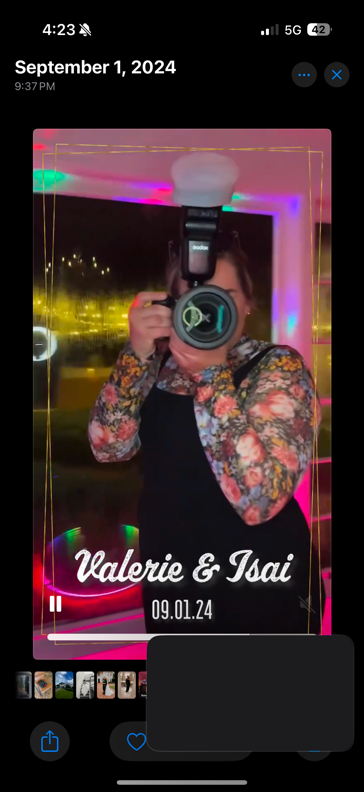 Wedding photographer shoots with flash at Valerie and Isai reception amid colorful neon lighting.