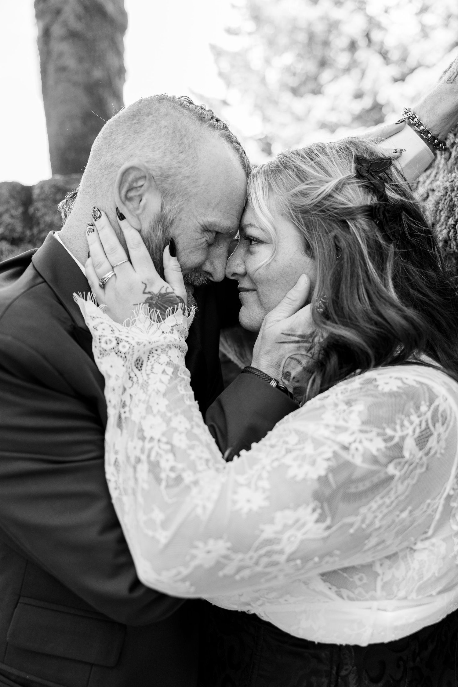 A romantic black and white image series featuring tender moments between a couple on their wedding day.