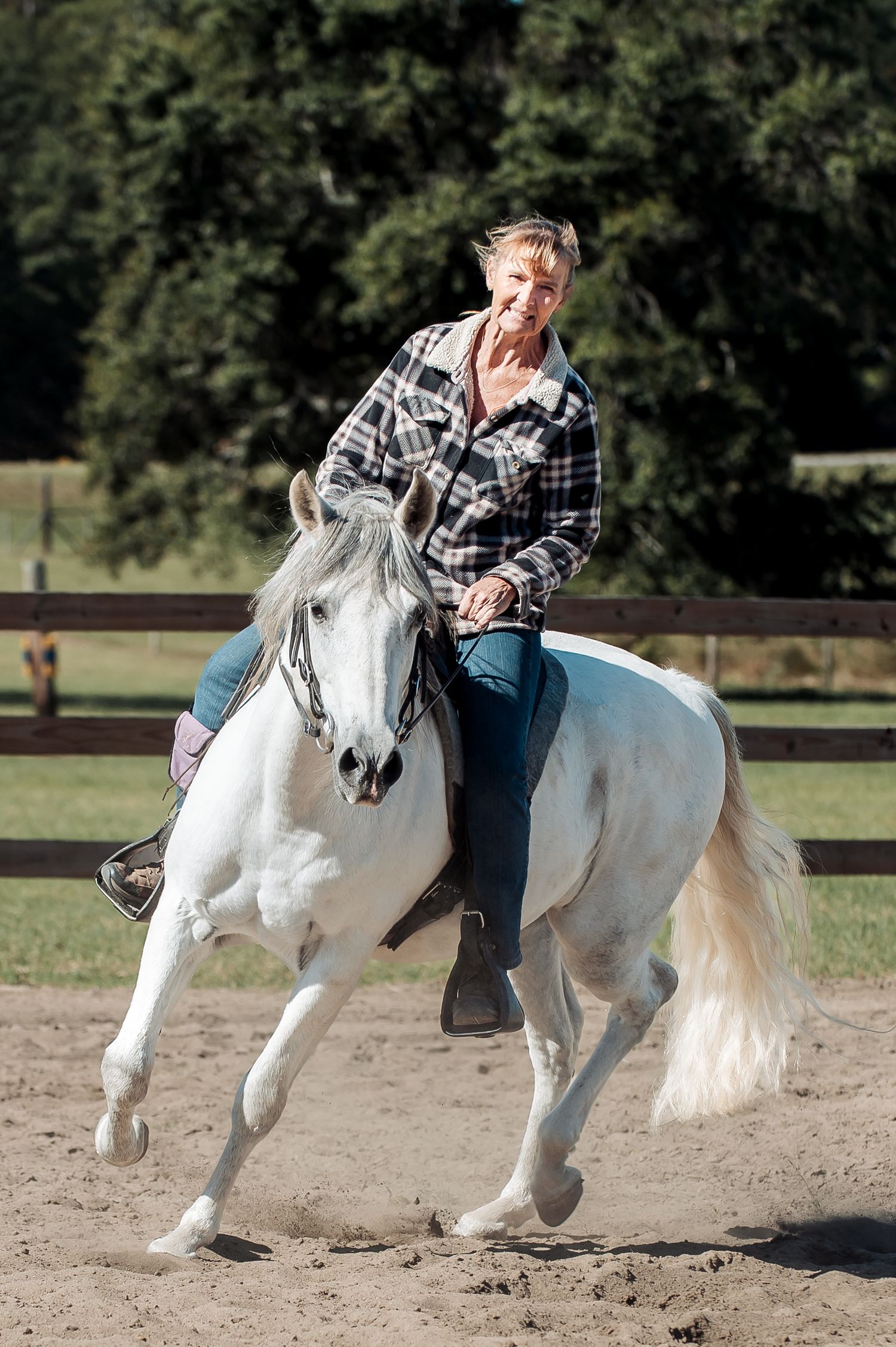 Smiling rider on a white horse during Adams Family Fun Day in Warrenton, GA, captured by Lace Cactus Photography.