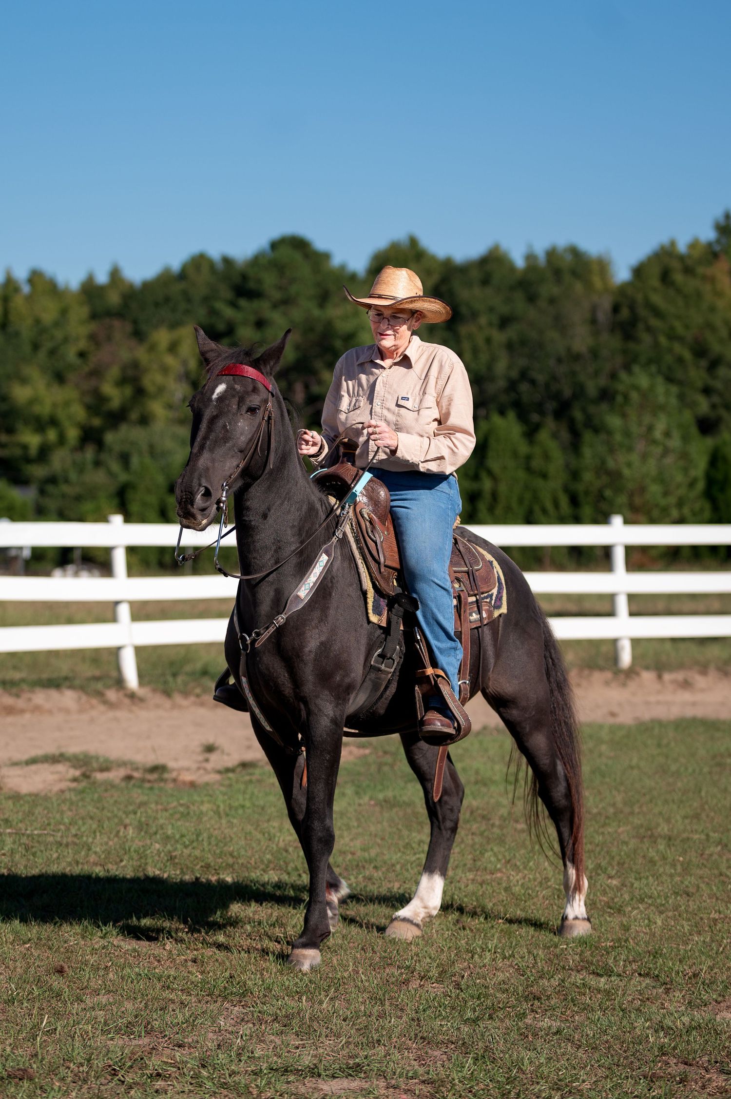 Western rider in a cowboy hat on a black horse at Tasch Stables during the Haunted Hooves horse show in Thomson, GA.