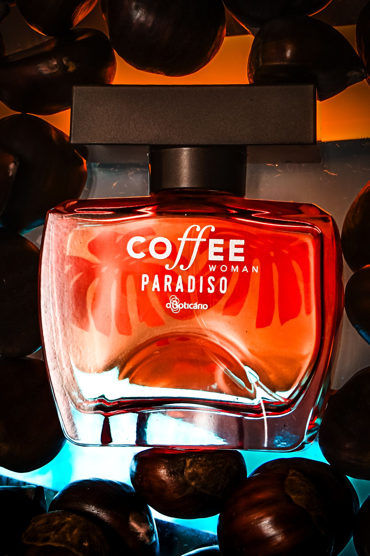 Coffee Paradiso perfume bottle with dramatic lighting and dark decorative elements.