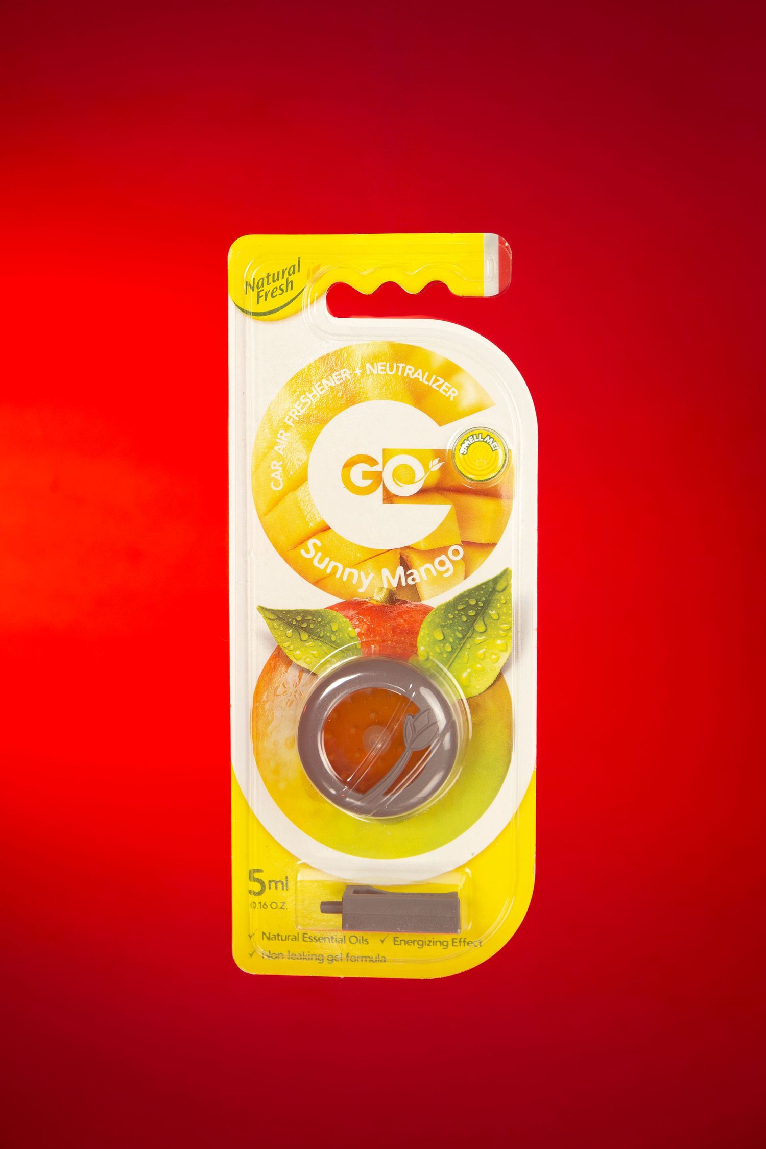 Natural Fresh GO Sunny Mango 5ml car air freshener in yellow packaging on red background.
