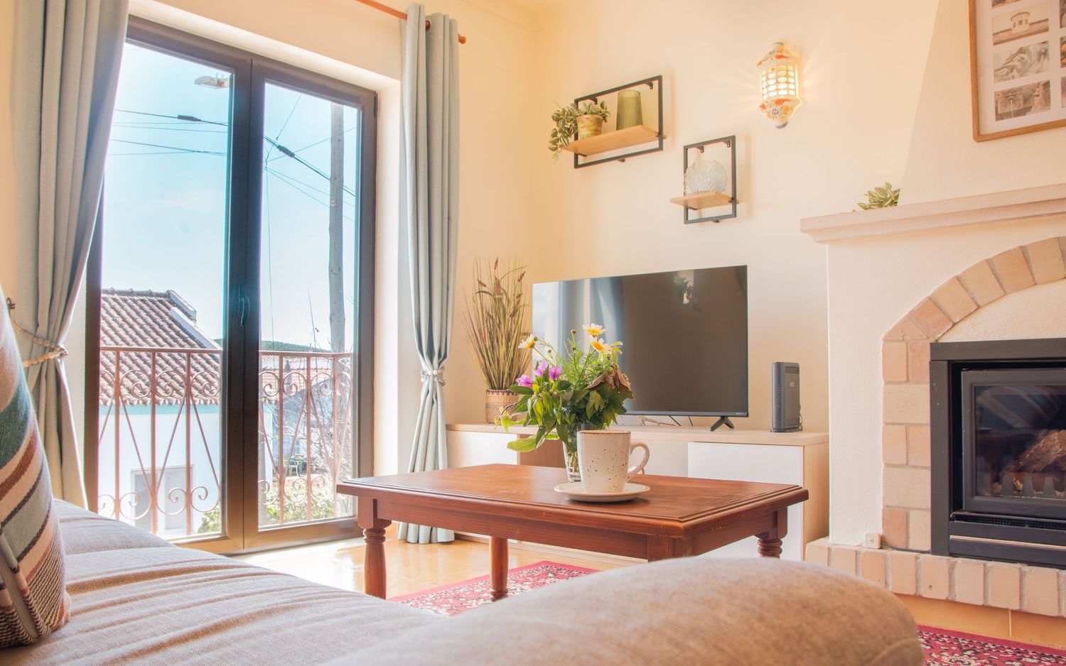 Modern apartment interior panoramic view showing living spaces, windows, and decor in warm natural lighting.