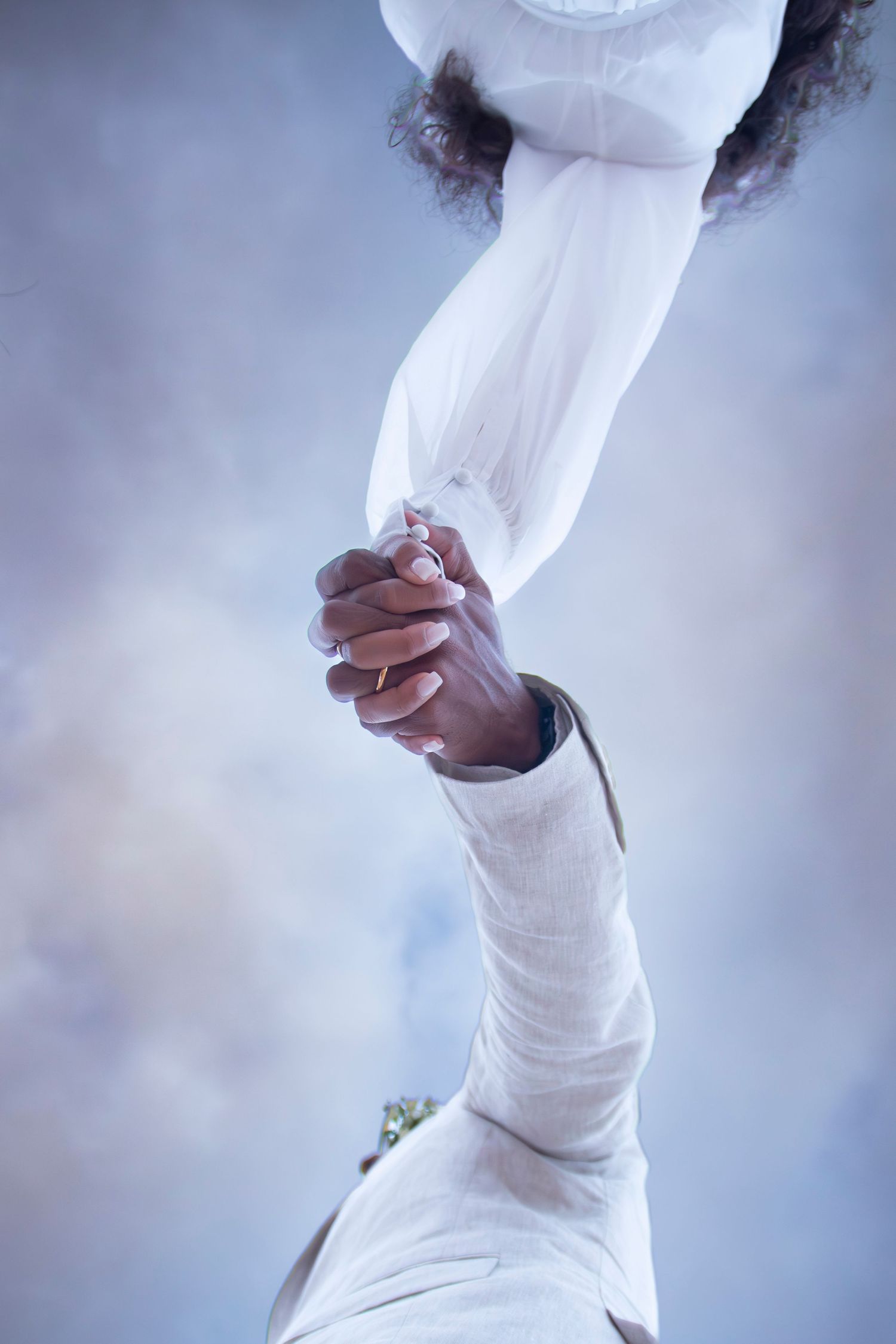 Sequence of close-up shots showing hands wrapping bandages around an injury or limb against a soft blue background.