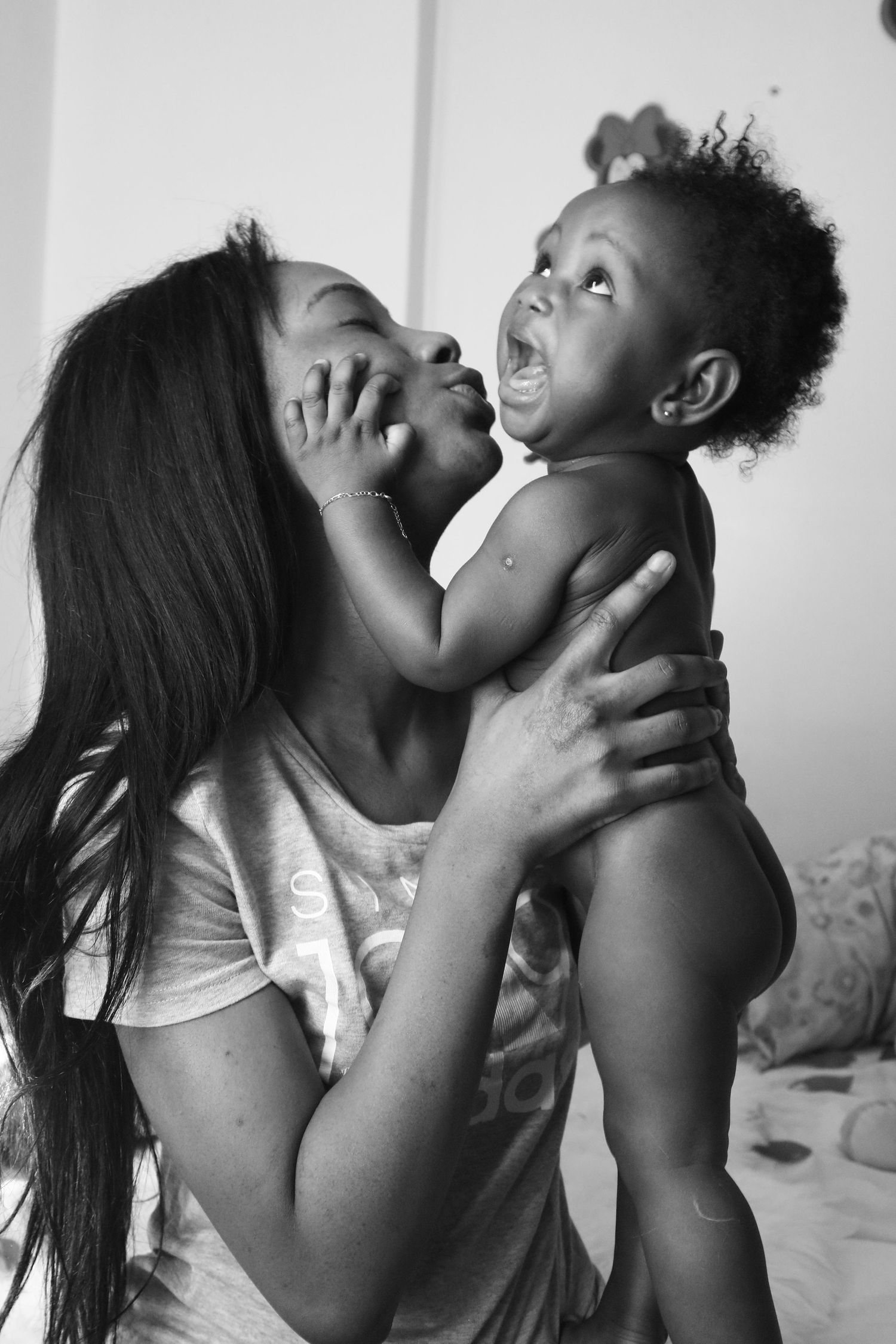 Black and white portrait capturing a tender moment of joy and laughter.