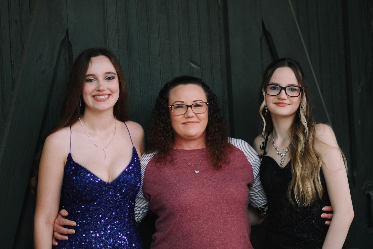 Mother and her children pose together.