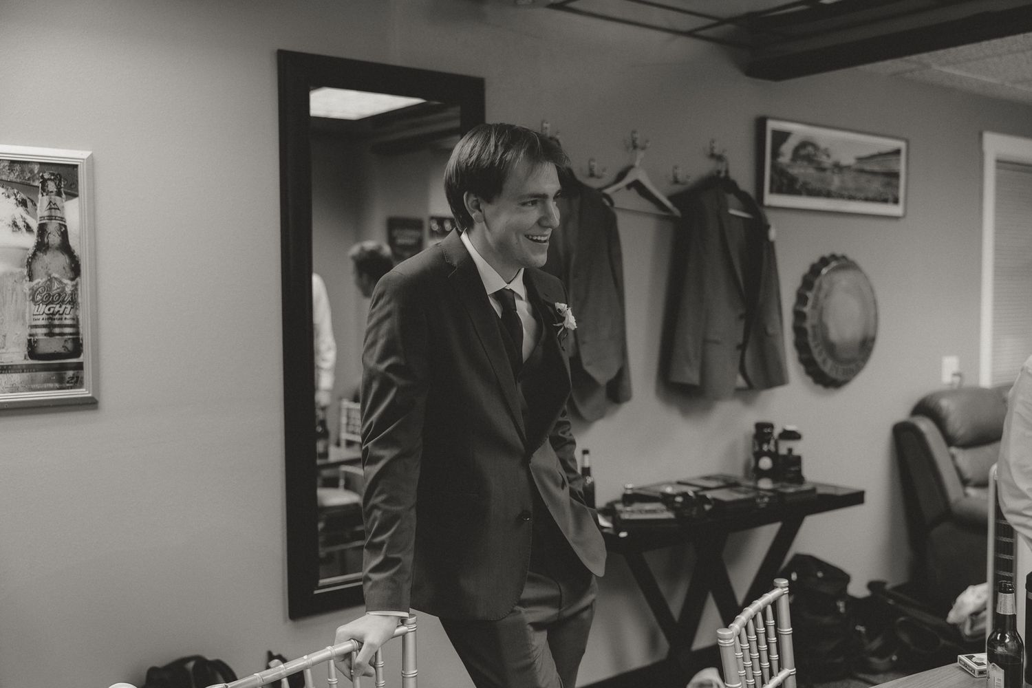 Black and white photo sequence showing a couple in an indoor setting with vintage decor.