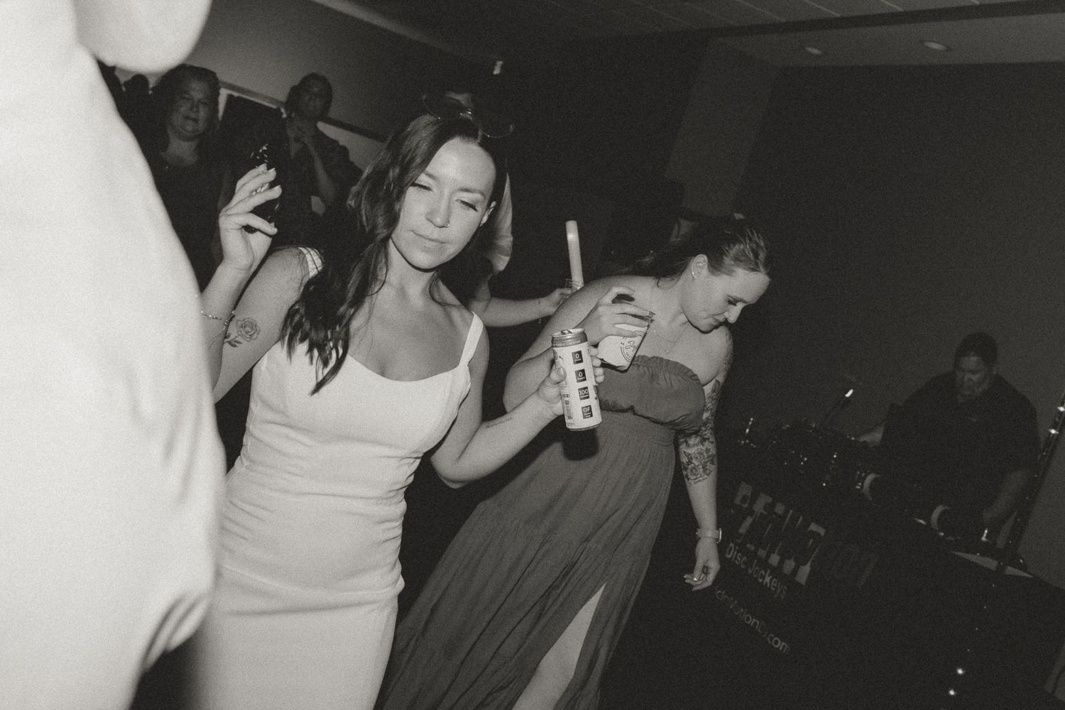 People dancing and having fun at a dimly lit party or celebration event.