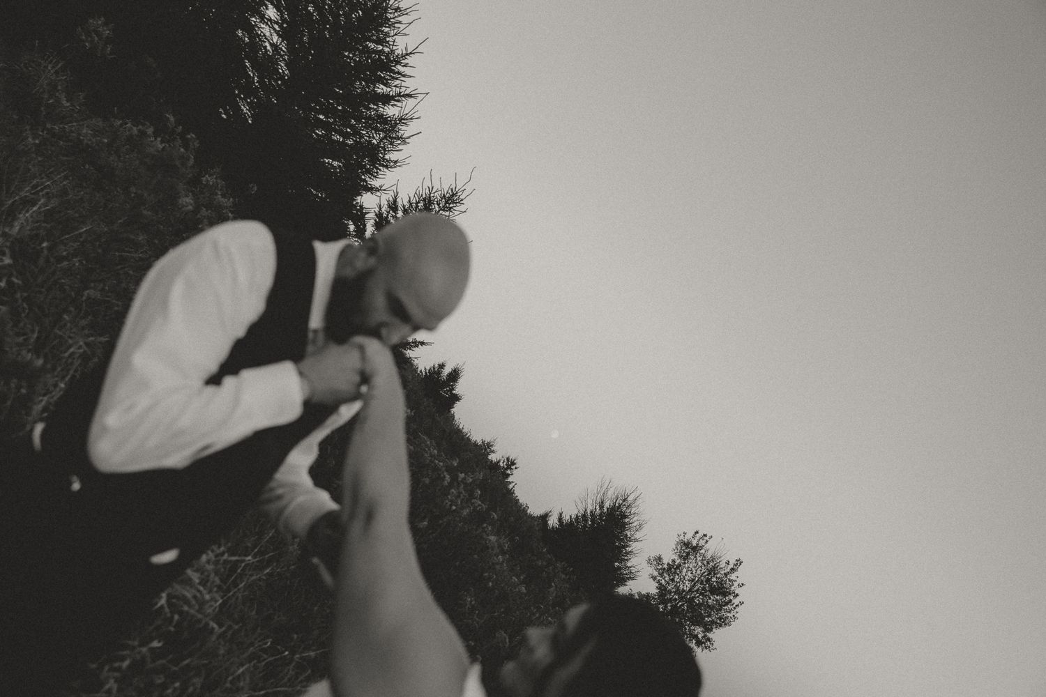 Wedding couple shares intimate dance moves during outdoor photo session.