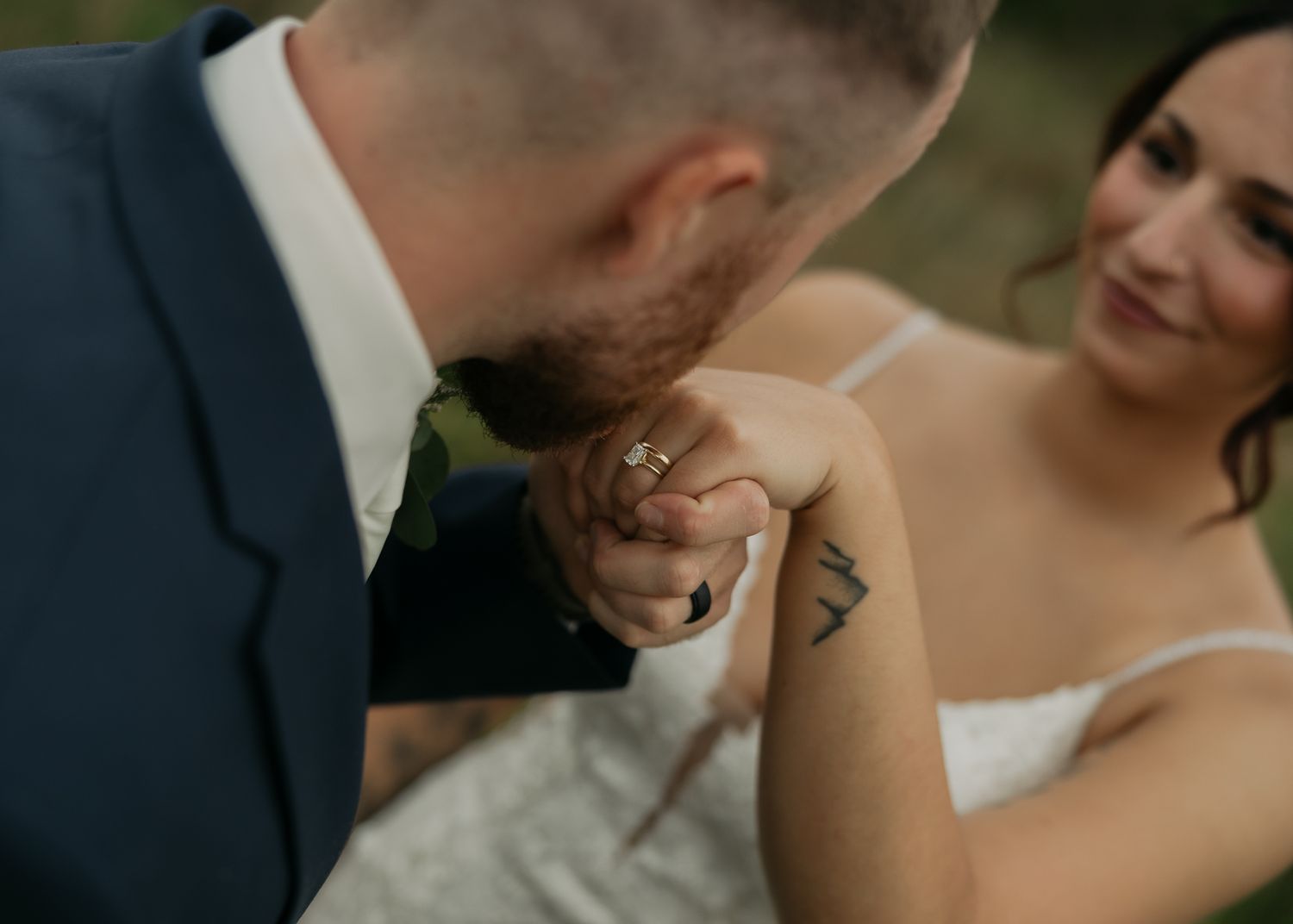 Close-up shot of a tender moment between newlyweds during their wedding photoshoot.