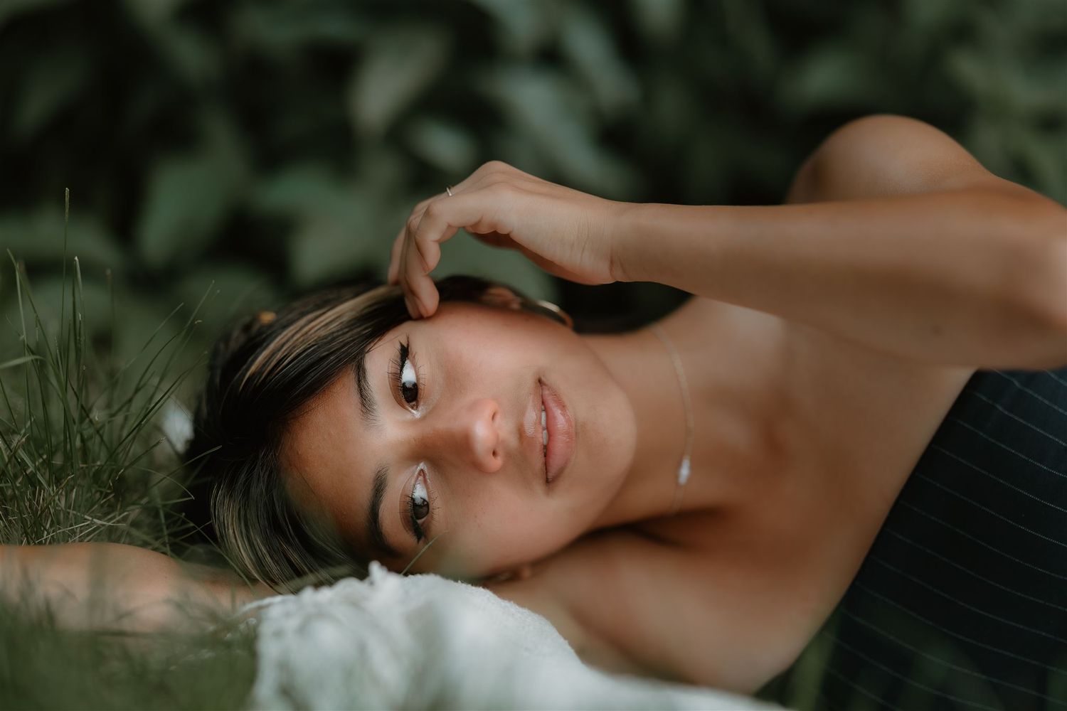 Portrait series featuring artistic close-up shots in natural lighting.