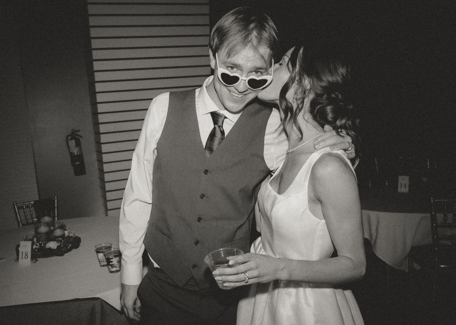 Black and white candid shots of wedding reception moments.