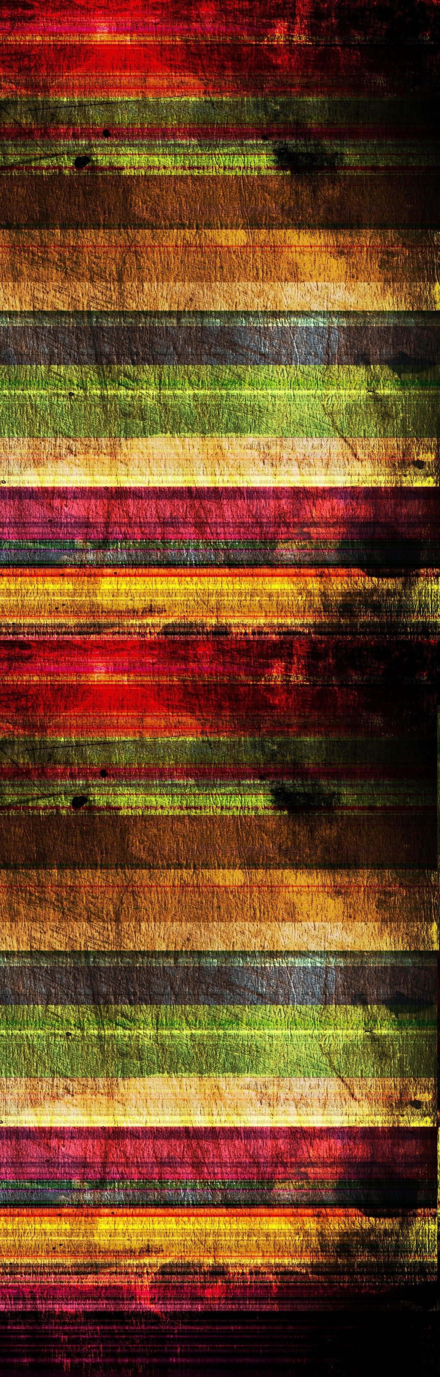 Grunge striped wooden planks background with colorful horizontal bands in red, yellow, green, and brown tones.