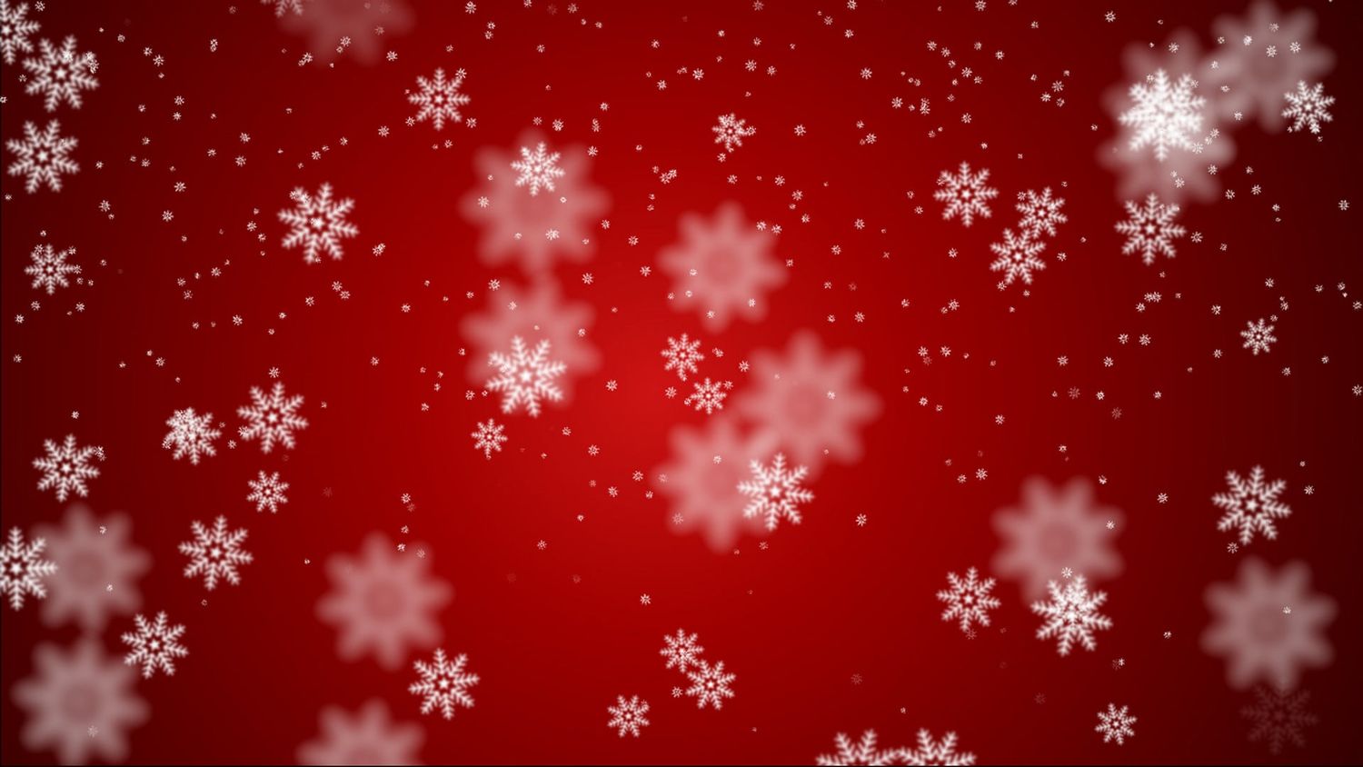 White snowflakes of various sizes falling against a deep red background, creating a festive winter and Christmas holiday backdrop.