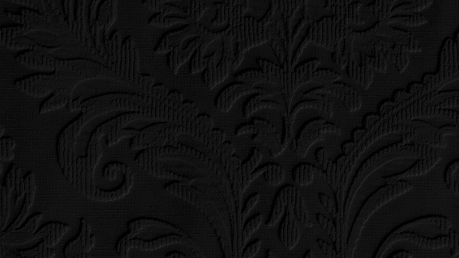 Black embossed damask fabric texture with elegant floral and leaf patterns in a dark, luxurious design.