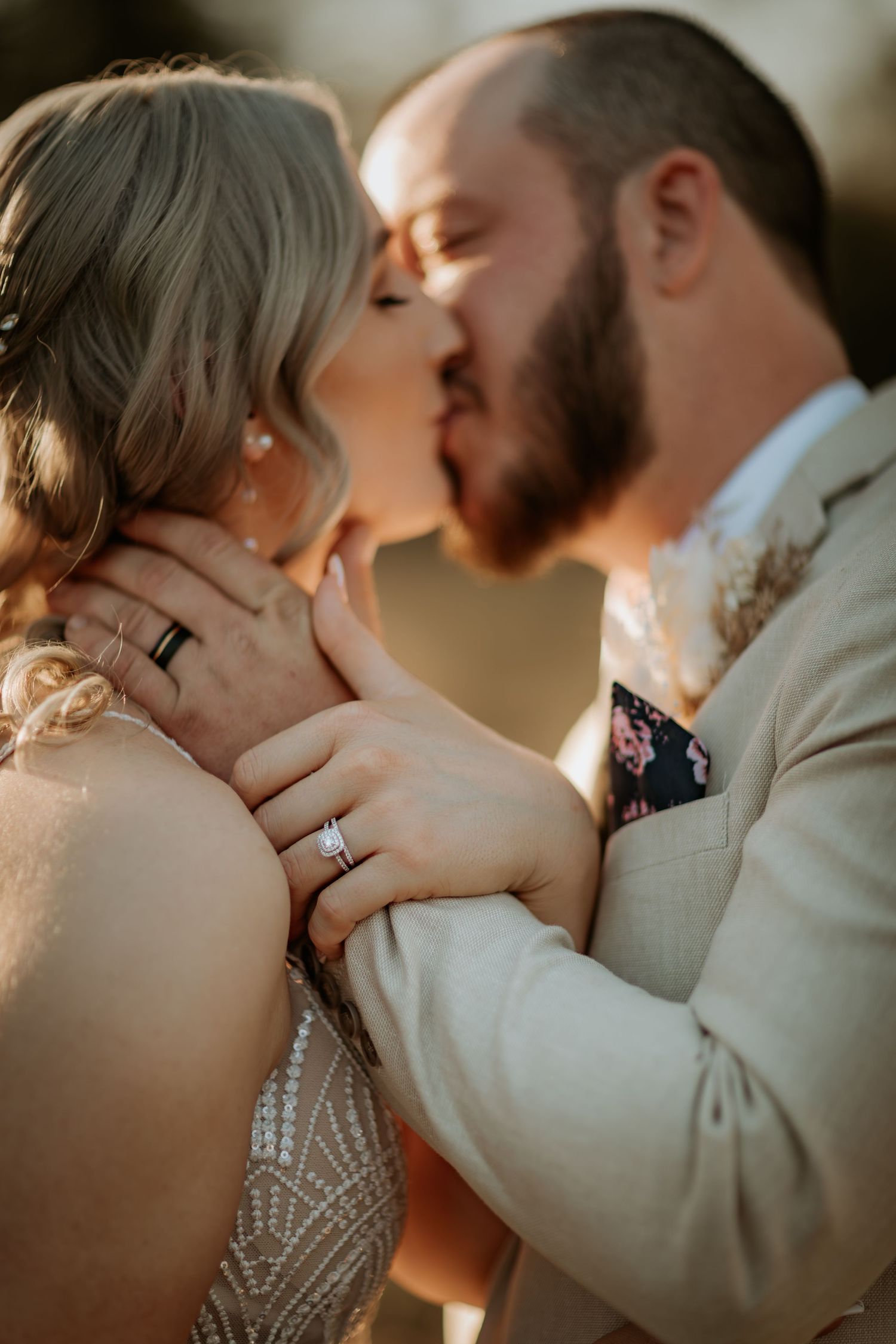 Close-up wedding portrait showing tender moment between newlyweds.