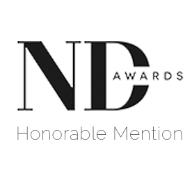 A black and white logo design with text and decorative elements arranged horizontally.