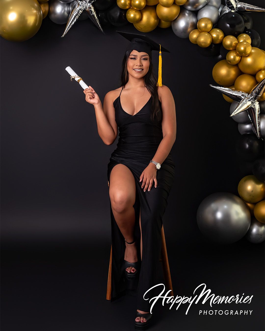 Celebratory graduation photos with gold and silver balloon decorations in studio setting.