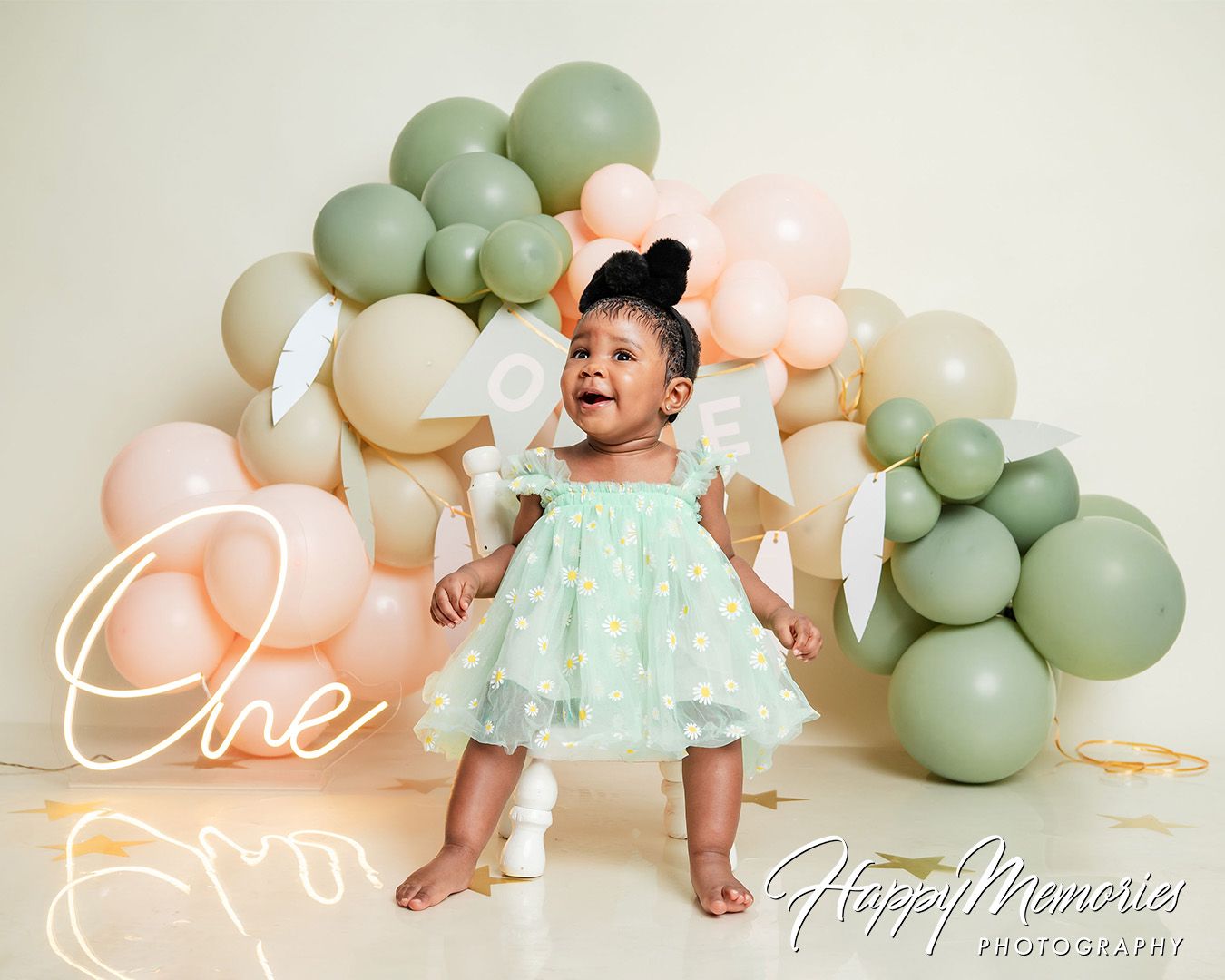 Soft pastel balloon decorations with mint green and pink colors against white background.