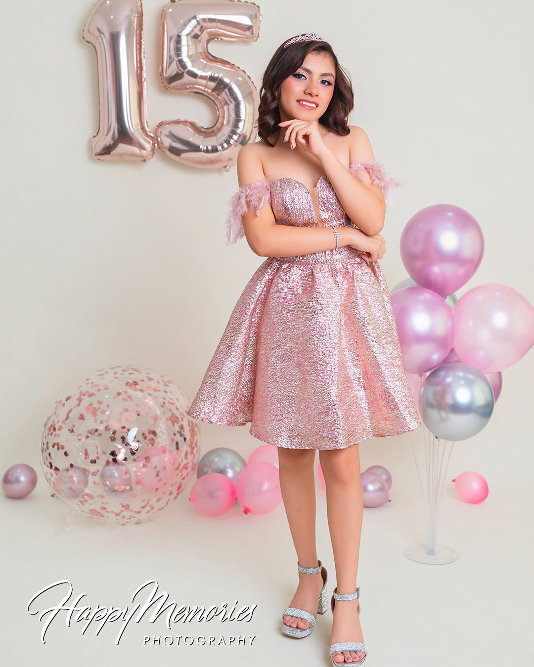Pink sequin dress photoshoot with rose gold number balloons and pastel decorations.