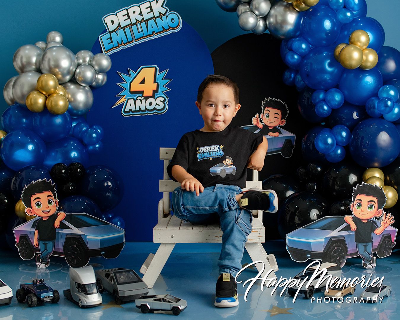 Boy celebrates 4th birthday with blue balloon arch, cartoon character cutouts, and Derek Emiliano themed party decorations.