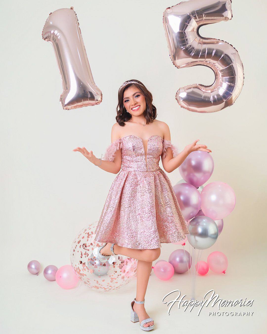 Quinceañera photos featuring a rose gold dress and matching metallic balloon decorations.