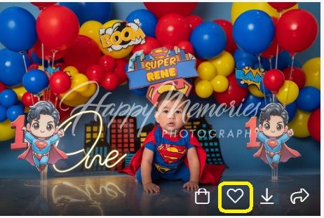 Superhero themed birthday backdrop with cartoon characters and red and blue balloons.