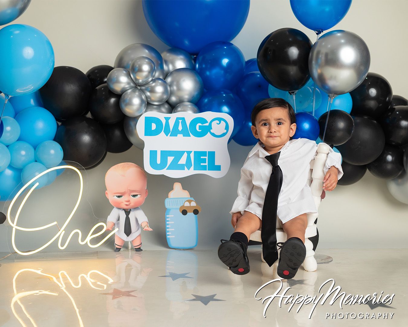 Festive blue and silver balloon arch decorations for a birthday party celebration.