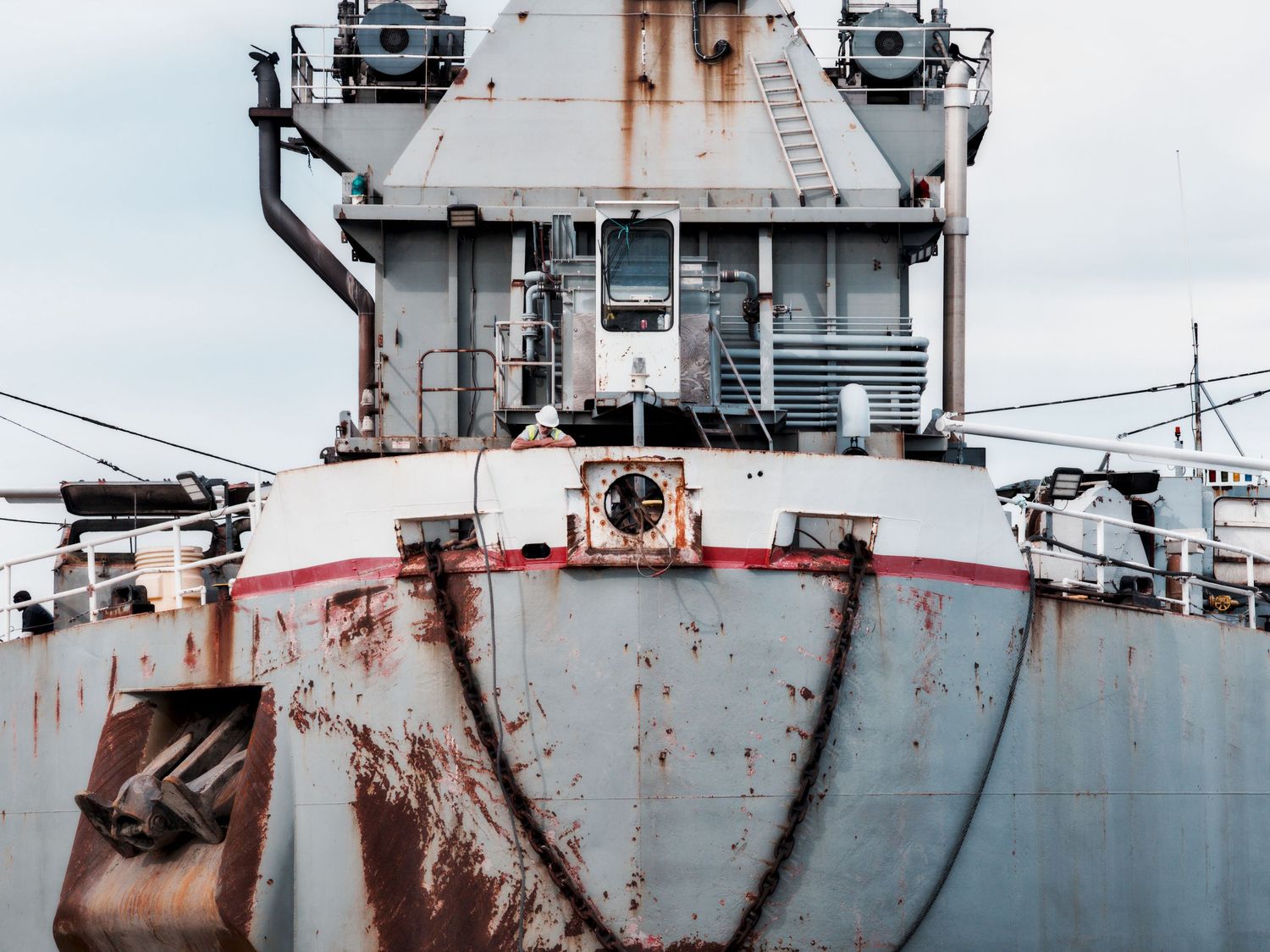 Bow shot of Great Lakes barge Ashtabula with sailor looking out