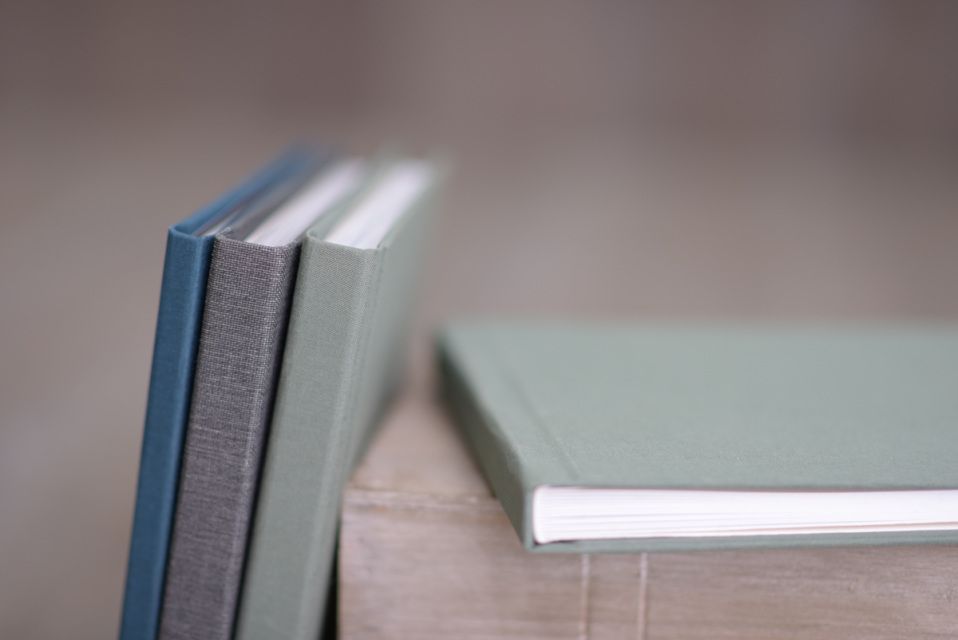 Minimalist white photo album pages shown in detail.