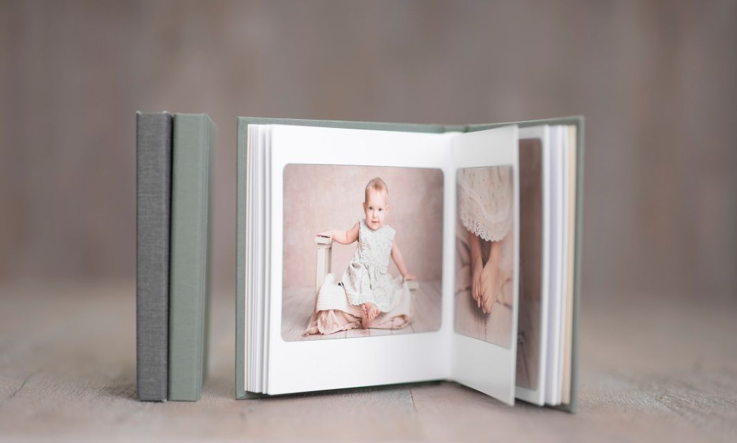 Close-up view of white photo album pages with soft focus.