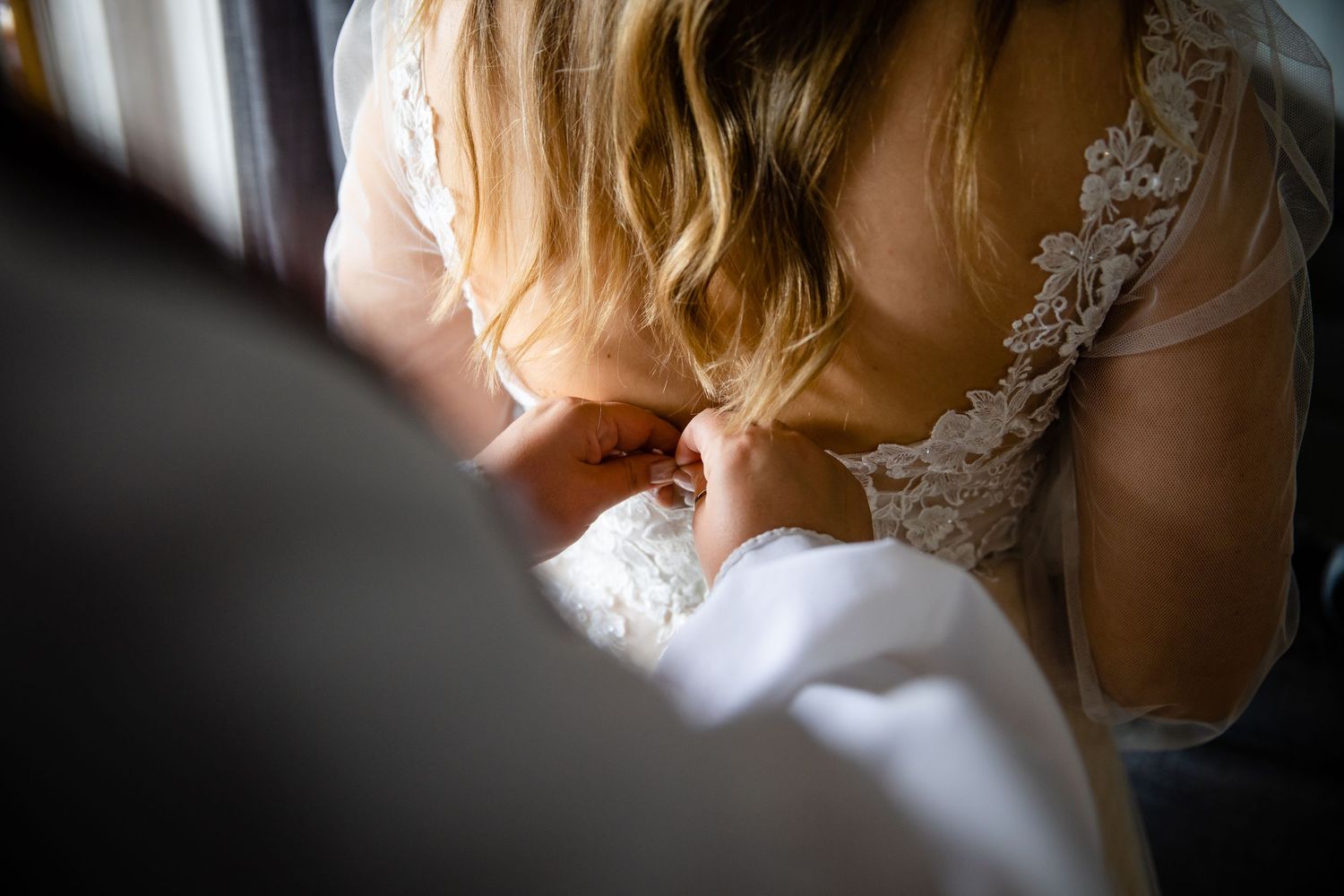 Intimate black and white portrait captures tender wedding moments.