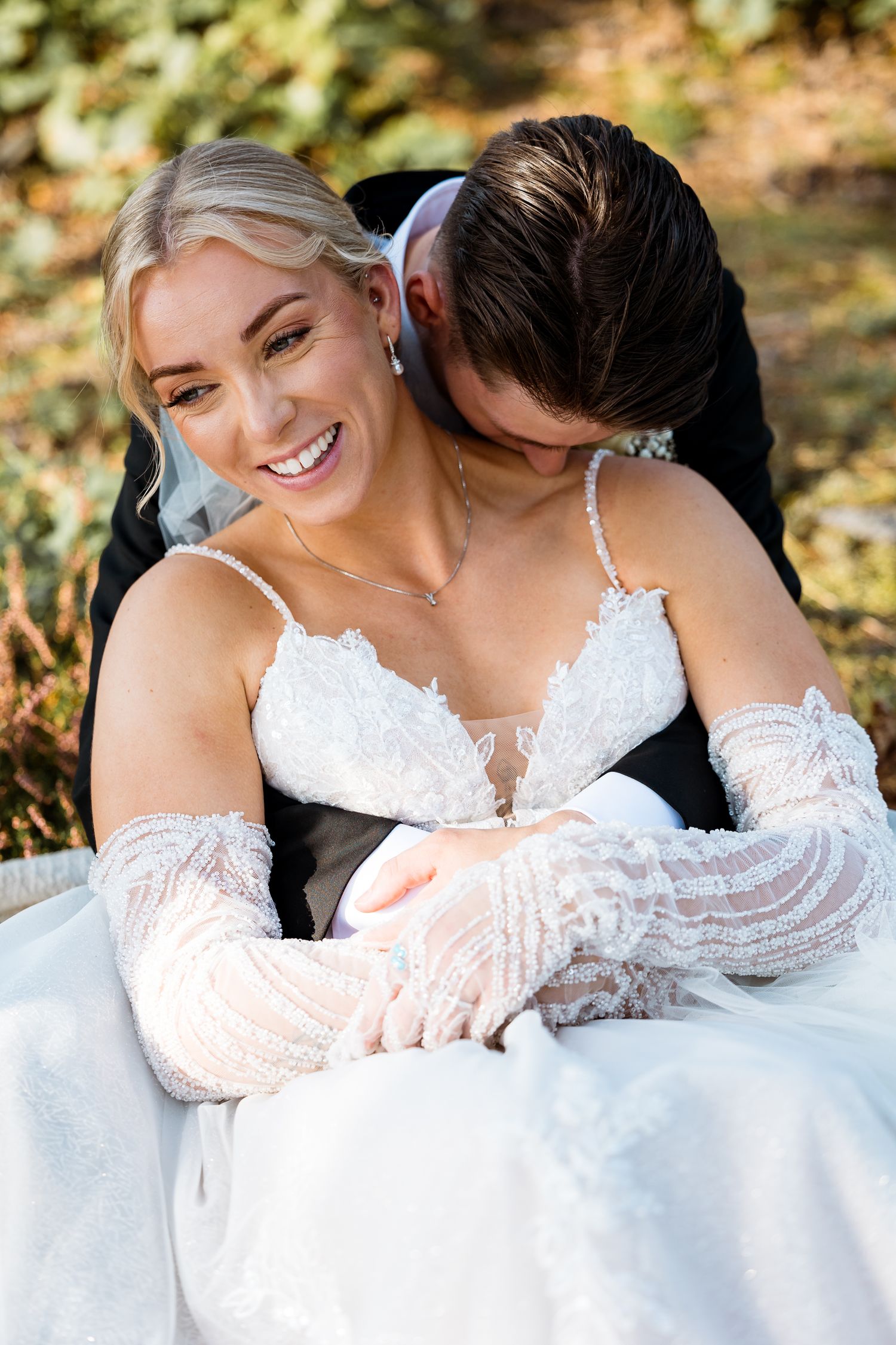 Intimate wedding portrait moments captured in natural outdoor lighting.