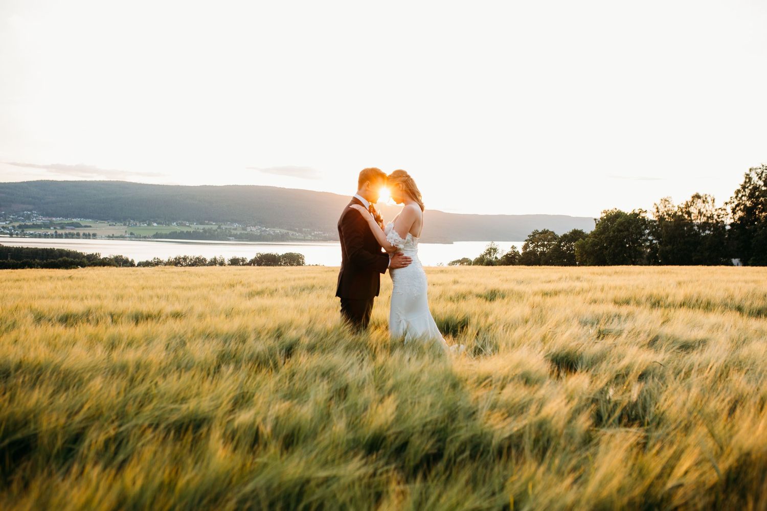 A romantic sunset wedding photoshoot in a golden wheat field.
