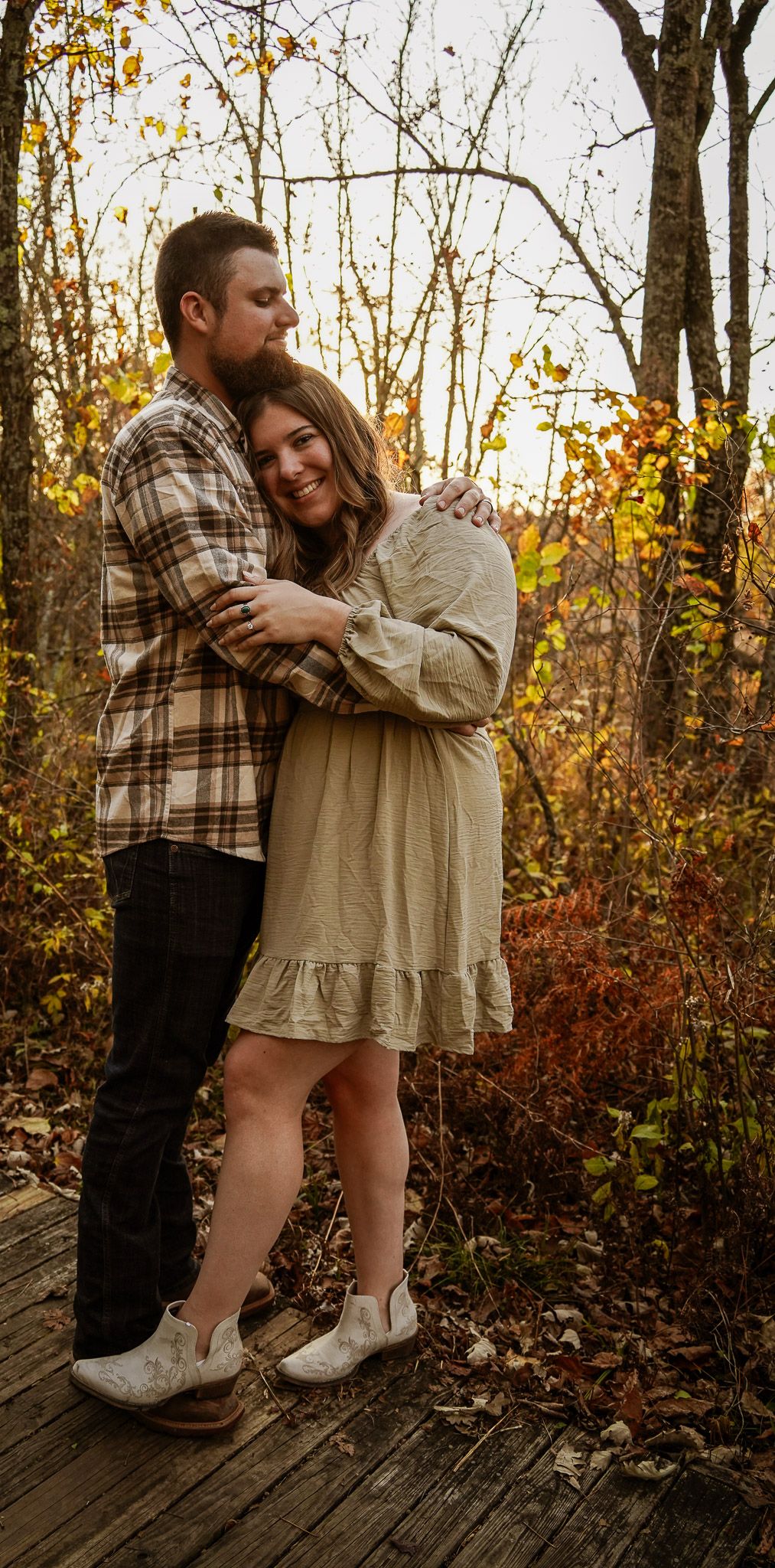 Wisconsin Couple and Engagement Photographer - Couple in woods in fall during an engagement session during sunset in Wisconsin.