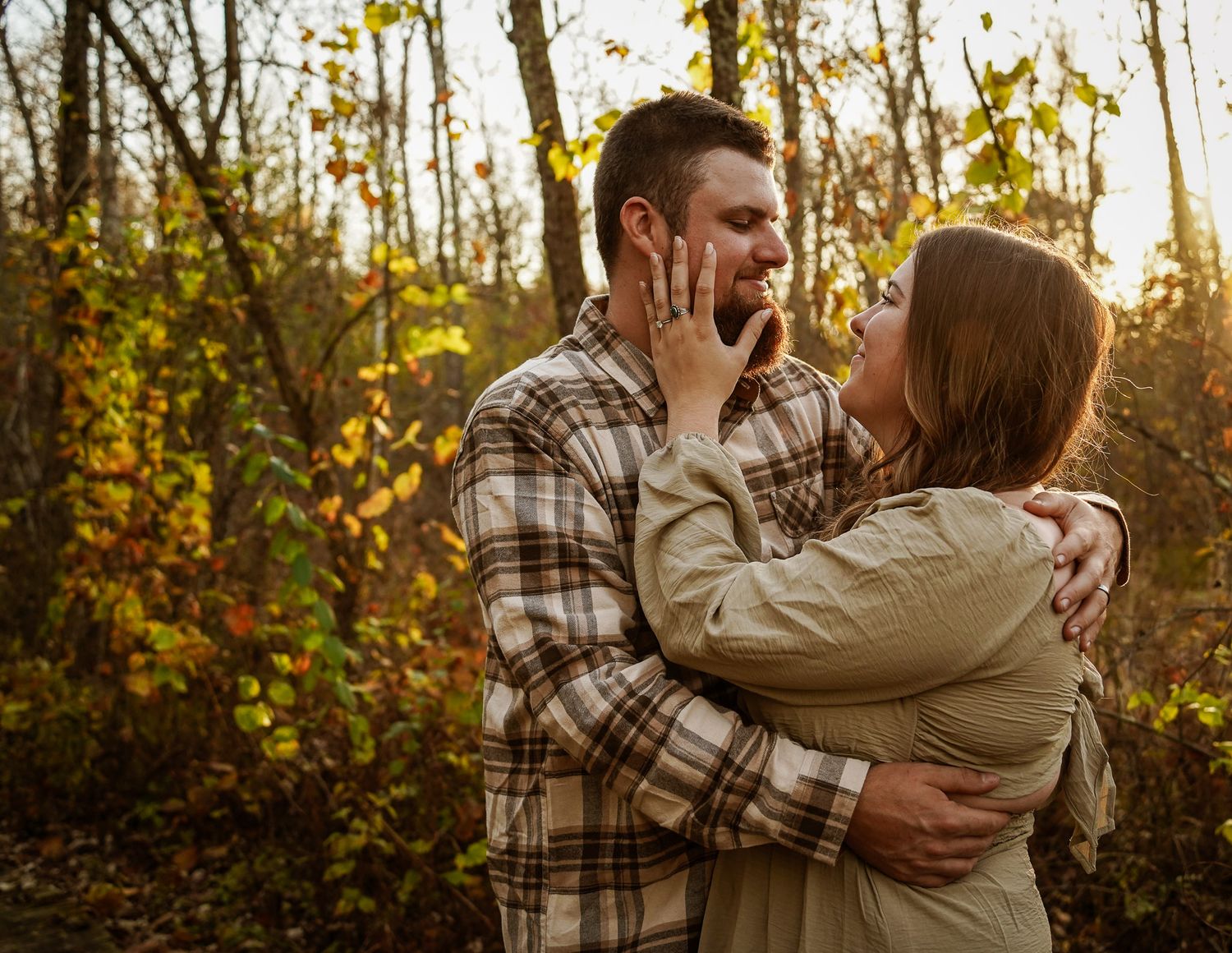 Wisconsin Couple and Engagement Photographer - Couple in woods in fall during an engagement session during sunset in Wisconsin.