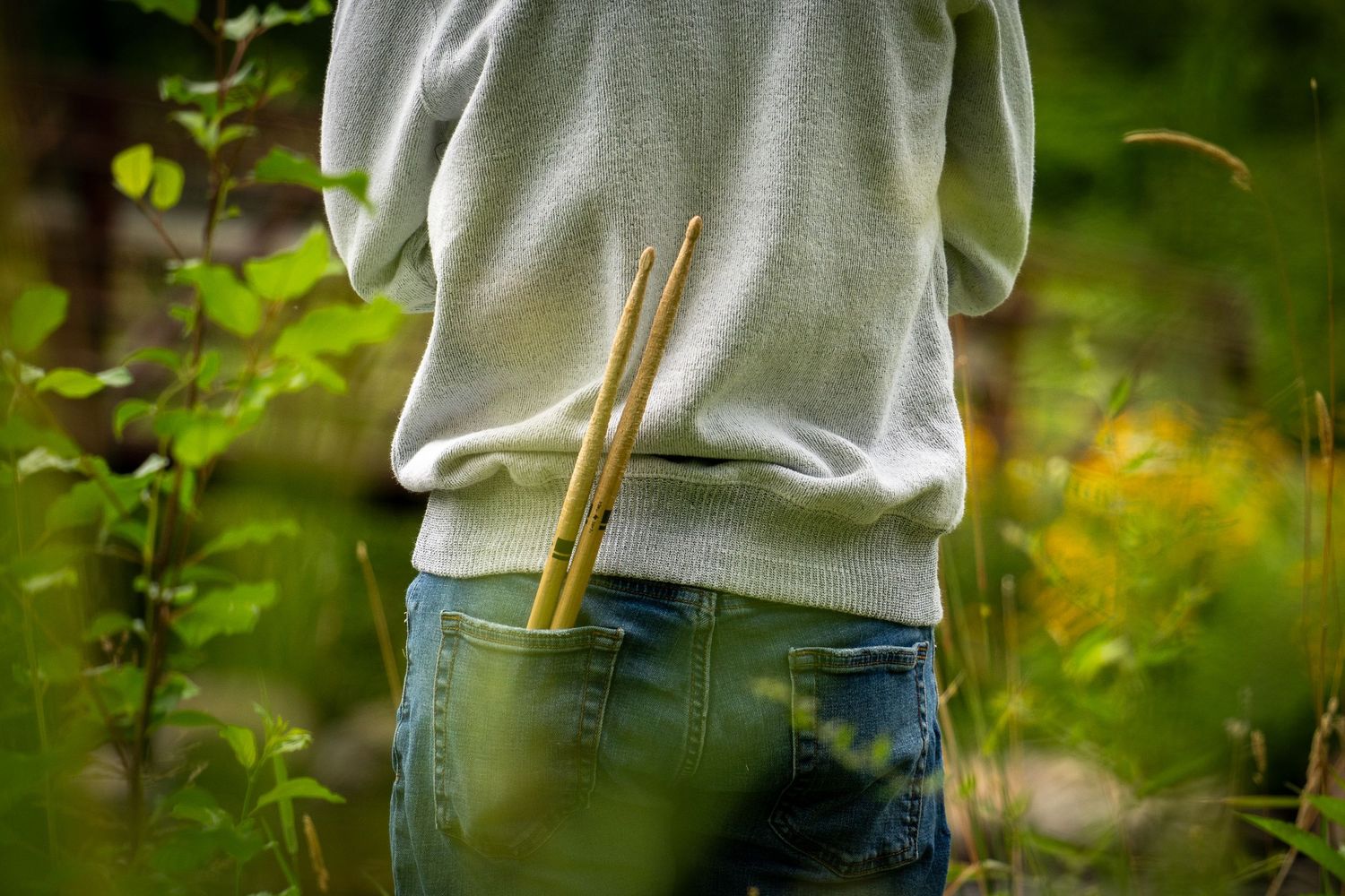 Wisconsin Senior and Portrait Photographer - Drummer senior boy with drumsticks in pocket in Wisconsin during a summer senior portrait.