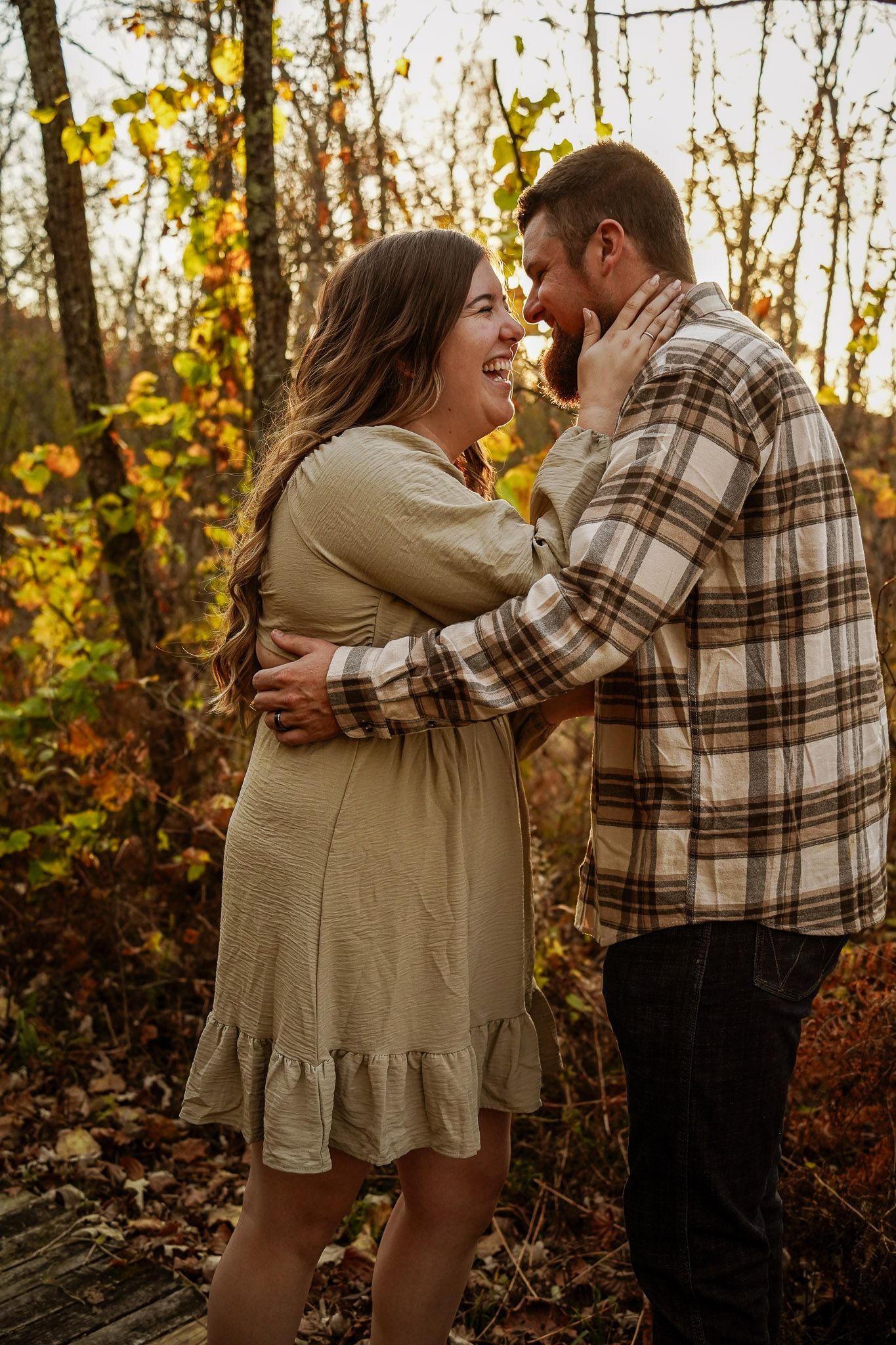 Wisconsin Couple and Engagement Photographer - Couple in woods in fall during an engagement session during sunset in Wisconsin.