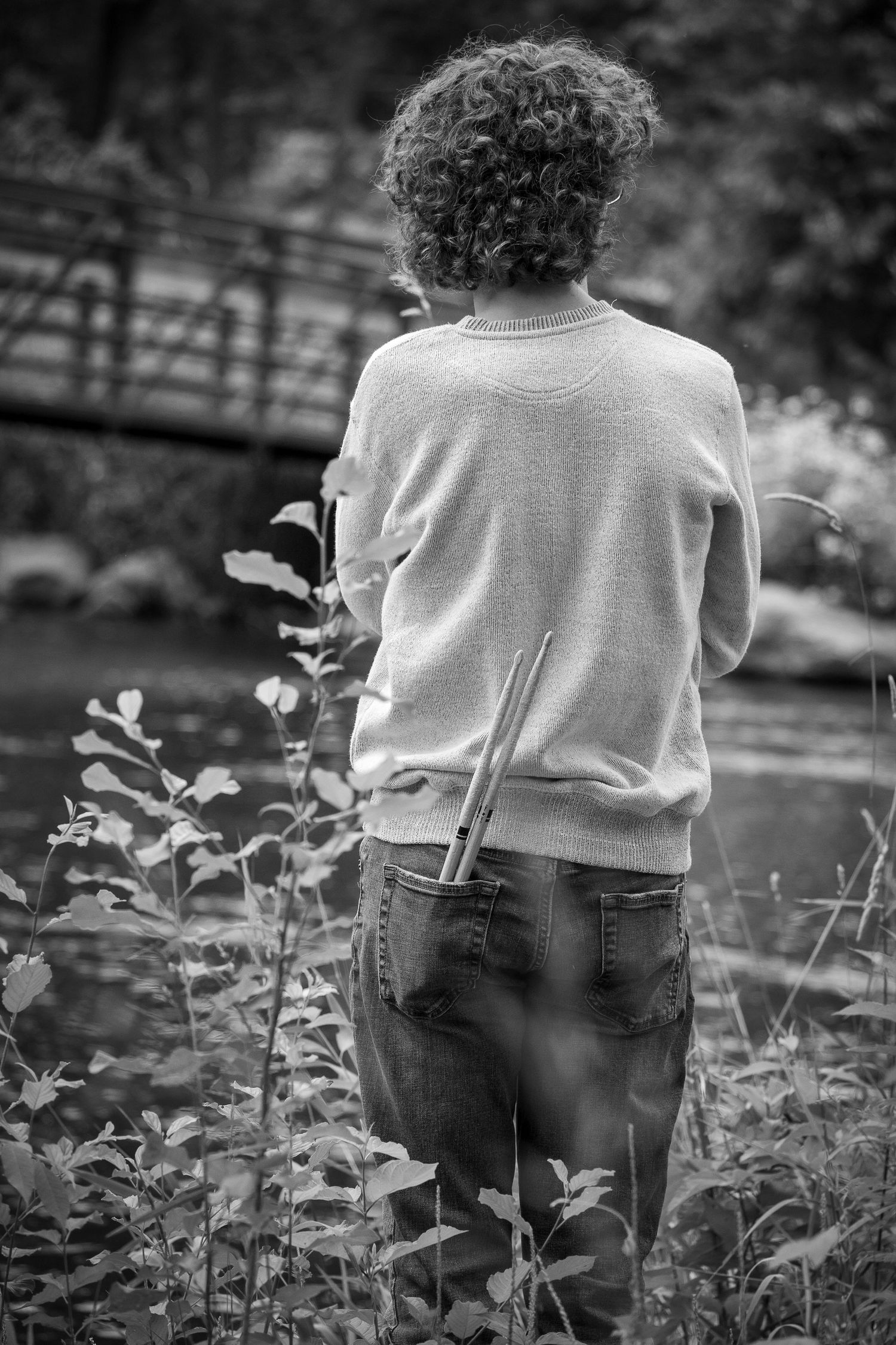 Wisconsin Senior and Portrait Photographer - Drummer senior boy with drumsticks in Wisconsin during summer senior portrait black and white.